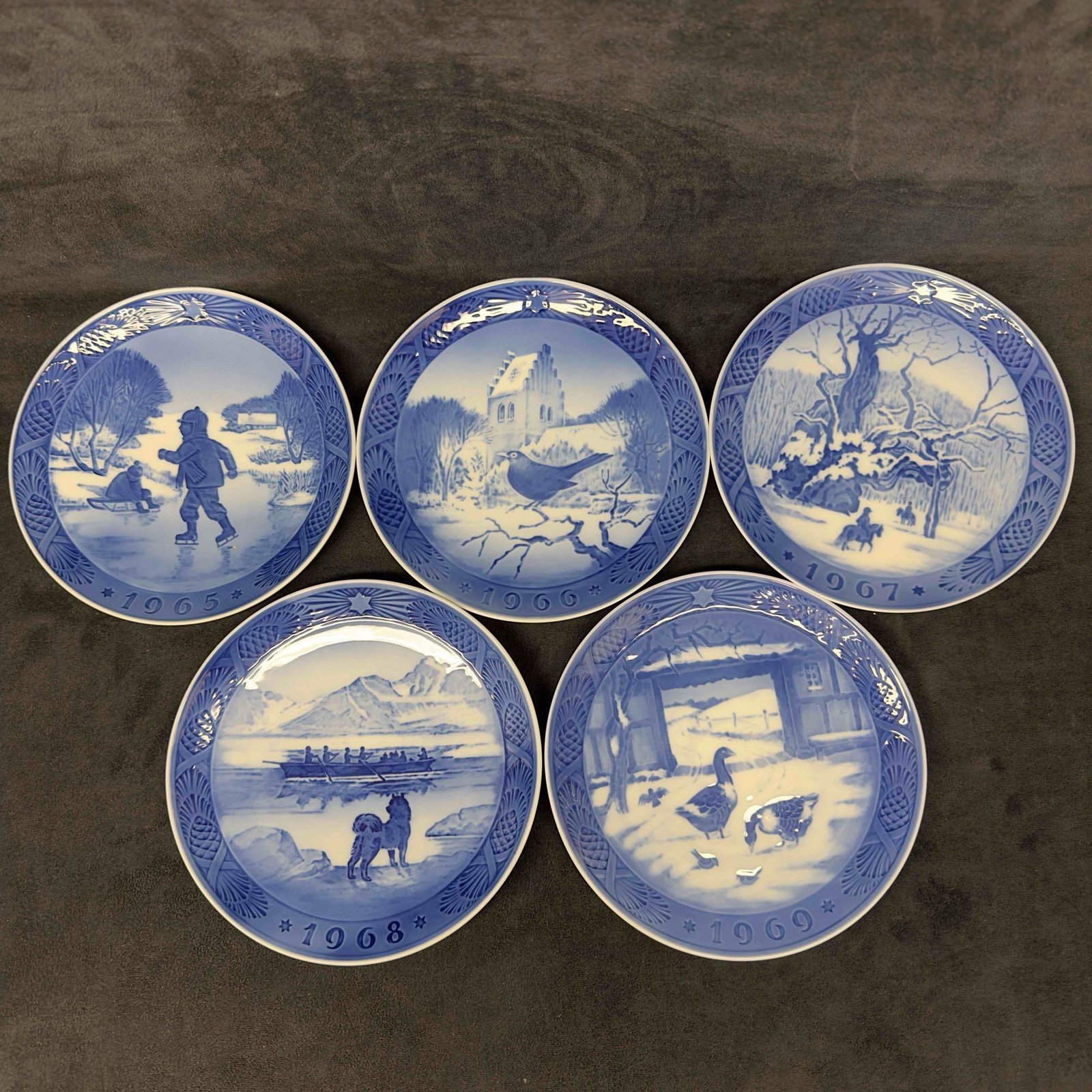 Royal Copenhagen Denmark 1960's Plate Set Kai Lange Lot of Five Christmas Blue Plates: Royal Copenhagen Denmark 1960's Plate Set Kai Lange Lot of Five Christmas Blue Plates. Five plates included in this set featuring 1965 Little Skaters, 1966 Blackbird at Christmas Time, 1