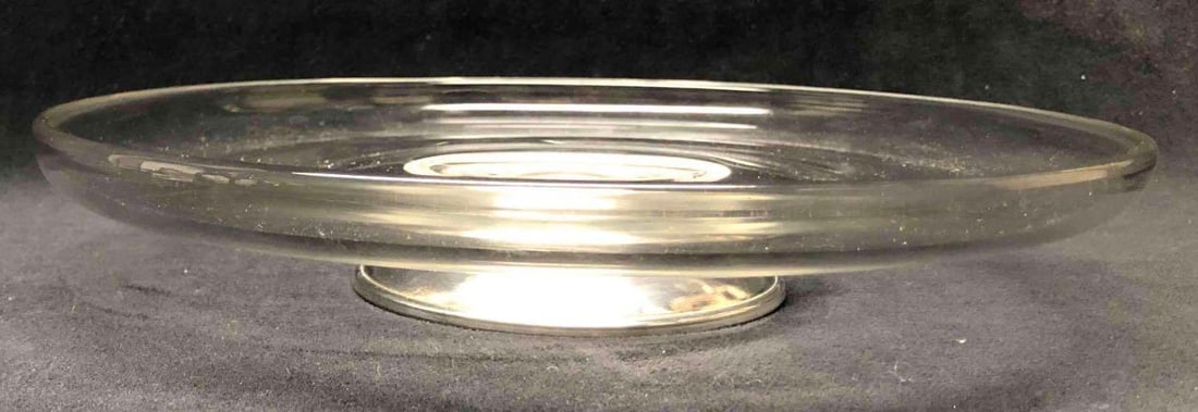 Crystal Serving Dish With Sterling Silver Stem: This lot contains a Glass Serving Dish With Sterling Silver Stem. It is approx 10 1/4" x 10 1/4" x 2" and it weighs about 1.7lbs. Overall the Serving Dish is in good used condition with some light