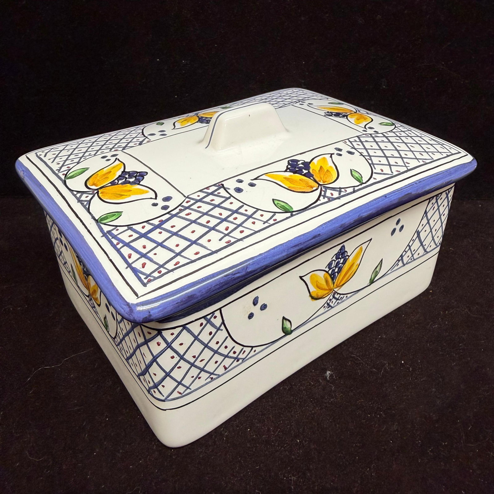 Tivoli Hand Painted Portugal Ceramic Covered Dish Lidded Trinket Box Zrike: Hand-painted ceramic covered dish by Zrike Tivoli, Portugal. Decorated with a blue lattice border and yellow floral motif. Marked Tivoli Hand Painted in Portugal for Zrike on the underside.