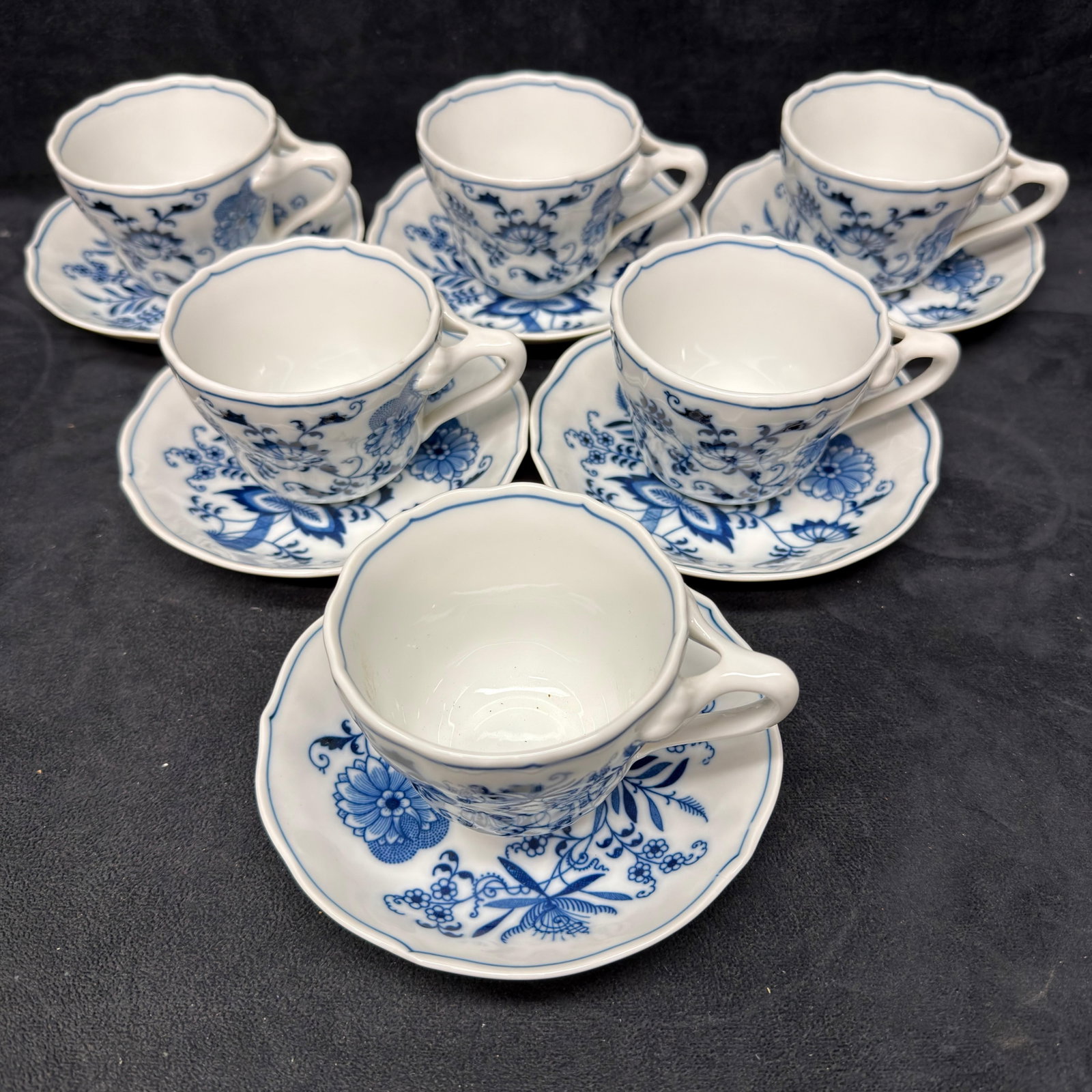 Blue Danube Blue Onion Porcelain Demitasse Cups and Saucers 6 Set: Set of six (6) Blue Danube porcelain demitasse cups with matching saucers featuring the classic cobalt blue "Blue Onion" floral pattern. Each piece bears the Blue Danube backstamp. These items