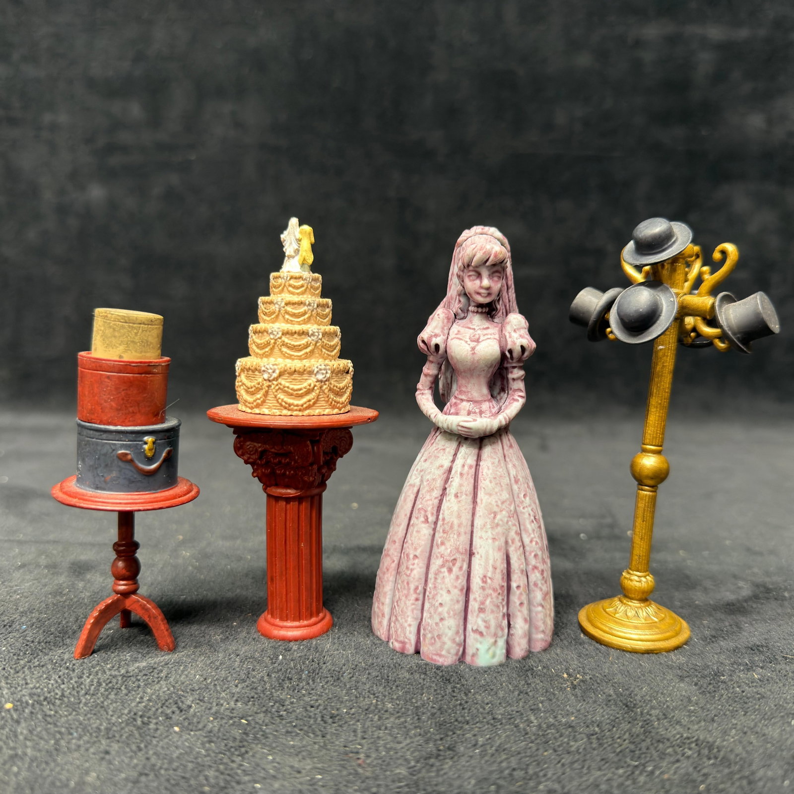 Disney Parks Haunted Mansion Figures: A variety of iconic pieces and characters from the Haunted Mansion. These items are in pre-owned, previously displayed condition with wear and surface markings. Please refer to all photos for full