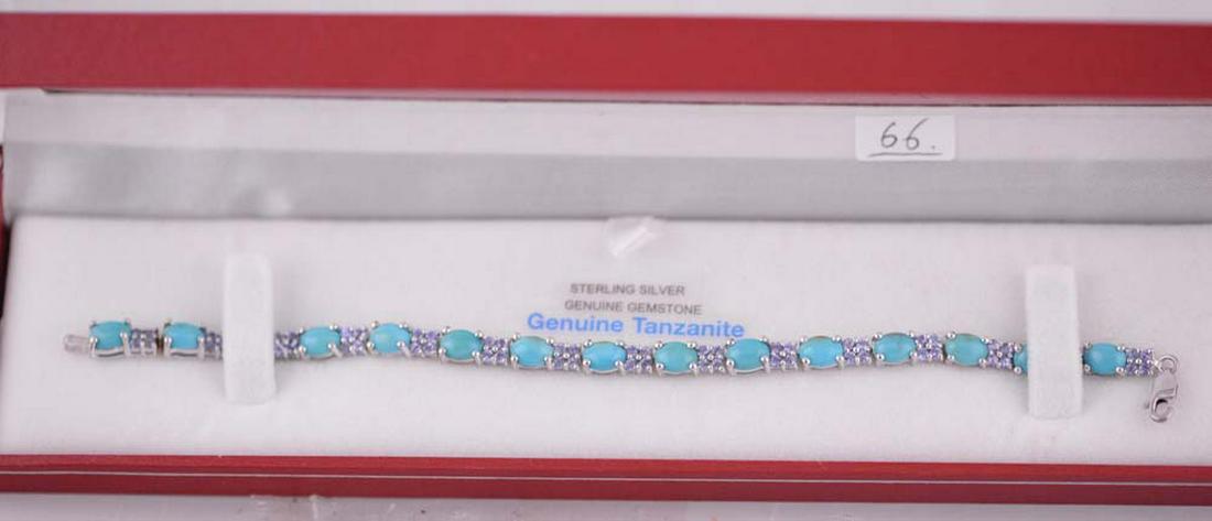 - Sterling Silver Genuine Turquoise and Tanzanite: () Ladies sterling silver (rhodium plated) gold, tanzanite and turquoise set bracelet. Fifteen cut and polished cabochon oval turquoises double carriage four prong, measuring 6.29 x 5.20 x 1.95mm, (de