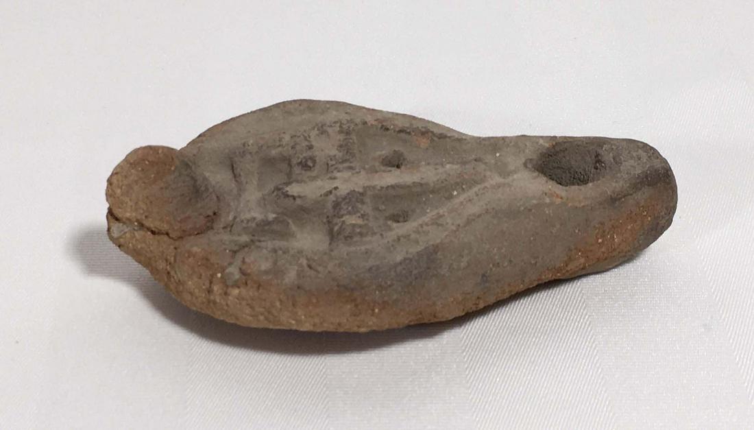 Antique roman lamp: Antique roman lamp Description: Ancient roman terracotta oil lamp with mesh, cross motif, genuine ancientProvenance: Nicolet Seminary museum. Dimension (PO): 4 1/2" x 2 1/2" x 1 1/4" Dimension (CM):