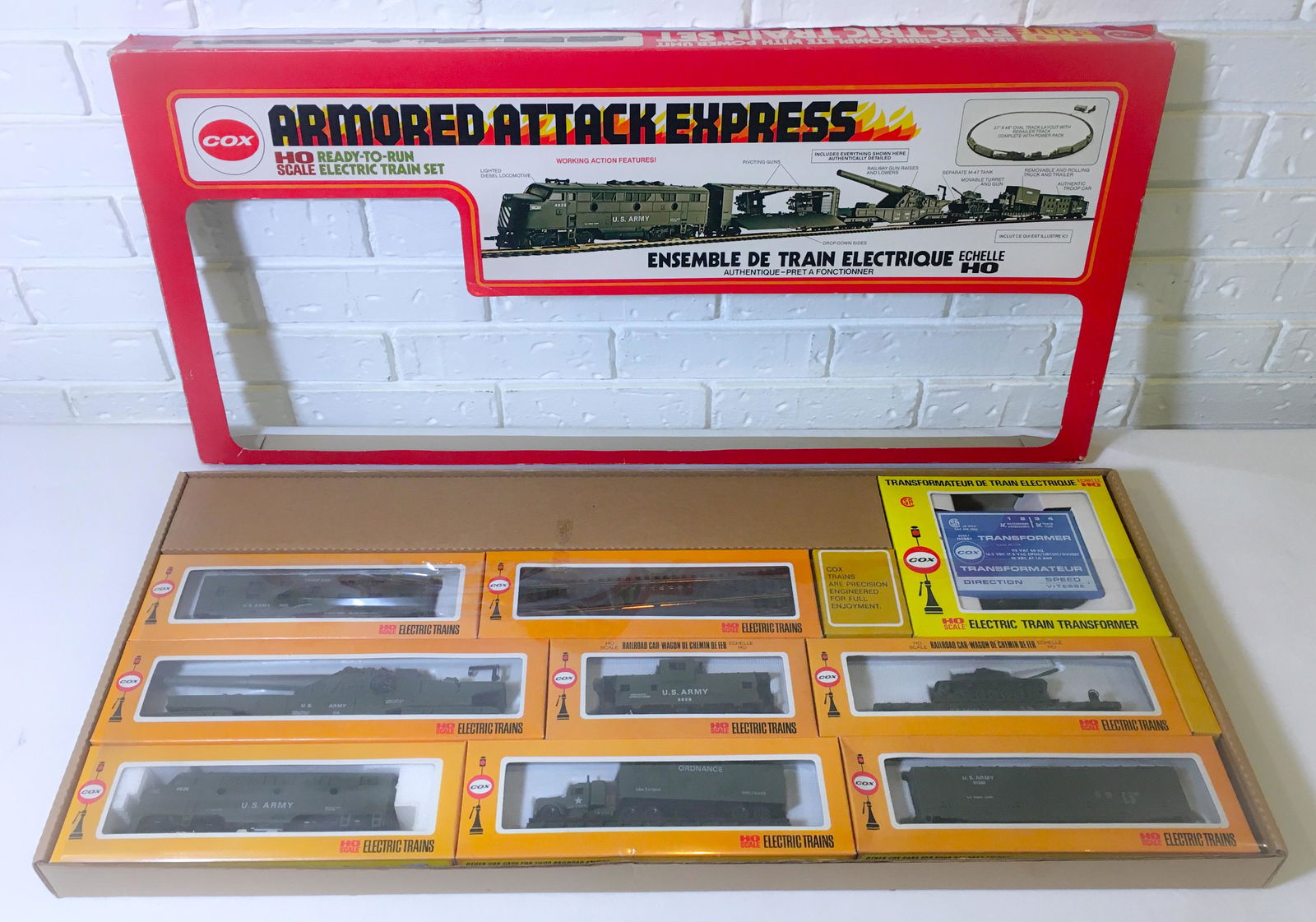 HO scale military train set: HO scale military train set Description: HO scale military train set, Cox armored attack express Dimension (PO): 31 1/2" x 14 1/4" x 2 1/4" Dimension (CM): 80.01 x 36.20 x 5.72 cm Condition