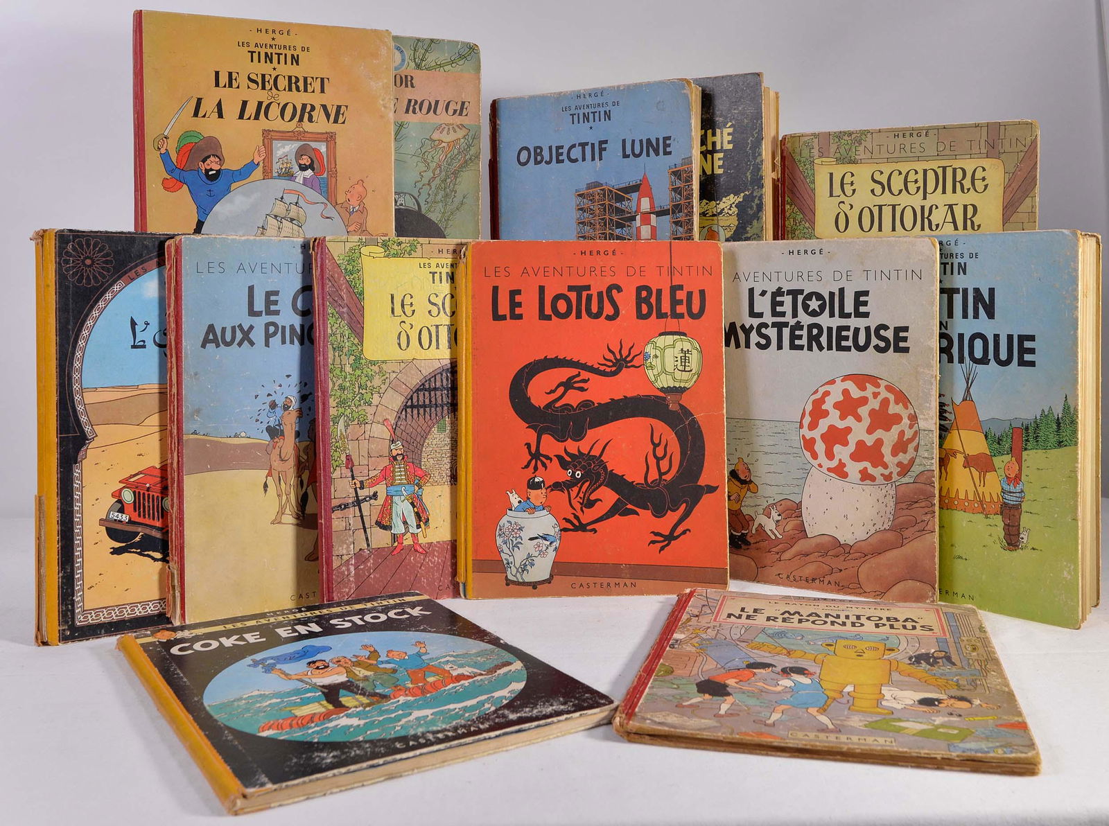 Hergé (Georges Remi) - Lot of 13 vintage Tintin albums: Hergé (Georges Remi) (1907-1983) Lot of 13 vintage Tintin albums Description: Lot of 13 vintage albums including Tintin and also Jo, Zette et Jocko Dimension (PO): 12" x 9 1/2" Dimension (CM): 30.4