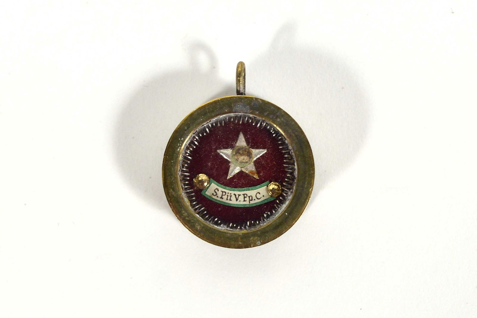 Relic of Saint Pius V: Relic of Saint Pius V Description: Saint Pius V (1504-1528), pope, metal reliquary, seal intact on the back. Dimension (PO): Diametre 1" Dimension (CM): Diametre 2.5 cm Condition report: