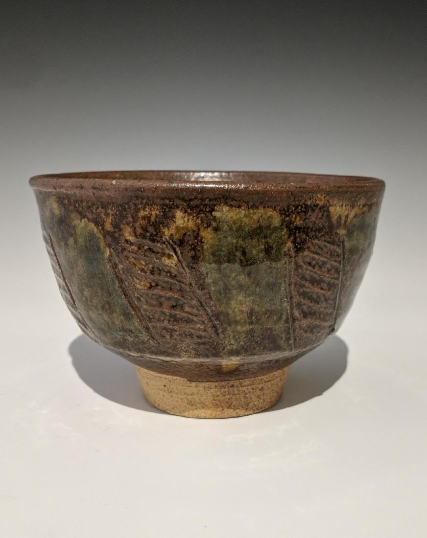 Warren MacKenzie - Bowl: Lot 118 Warren MacKenzie - Bowl American (1924-2018) Bowl stoneware with tenmuko and green glaze MacKenzie stamp on foot 3 1/2 x 5 1/4 inches Provenance: from the Collection of Arthur & Lillian Weiss,