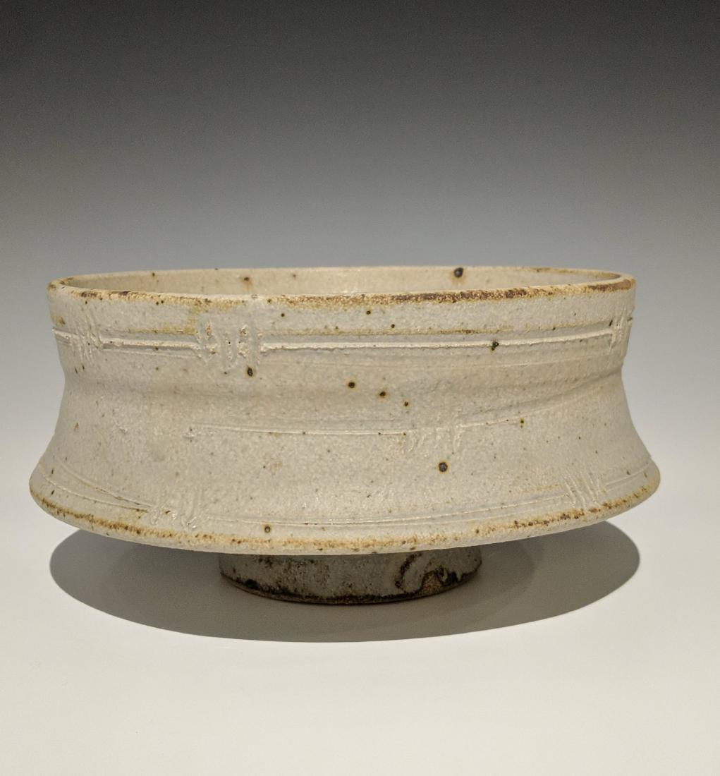 Warren MacKenzie - Drop rim bowl with barbed wire: Lot 124 Warren MacKenzie - Drop rim bowl with barbed wire pattern American (1924-2018) Drop rim bowl with barbed wire pattern stoneware with matte grey glaze 4 x 8 1/2 inches Provenance: from the Col