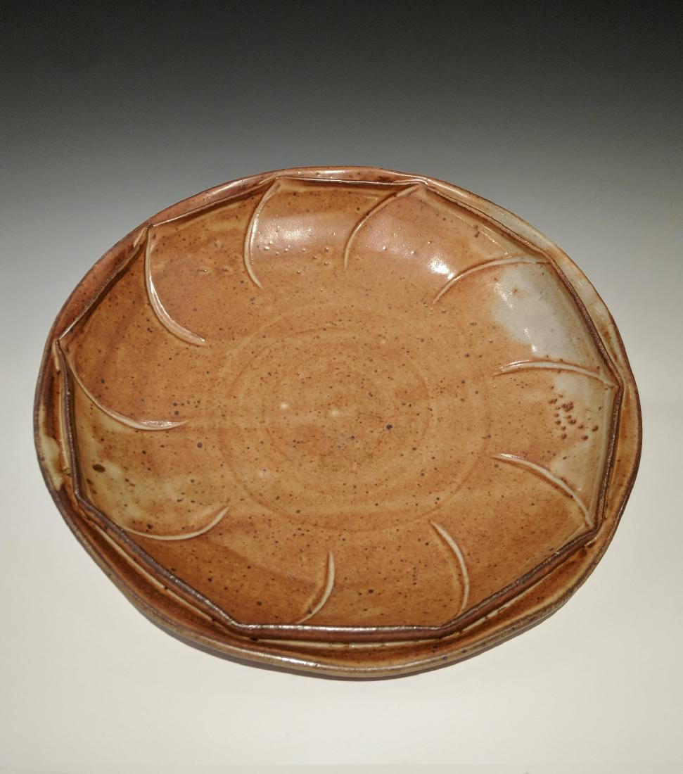 Warren MacKenzie - Plate with double rim: Lot 125 Warren MacKenzie - Plate with double rim American (1924-2018) Plate with double rim stoneware with shino glaze MacKenzie stamp on foot 3 x 14 inches Provenance: from the Collection of Arthur
