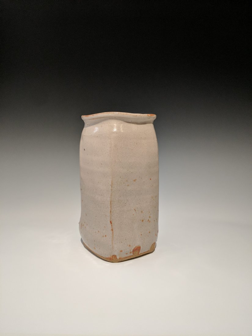 Warren MacKenzie - Square vase: Lot 128 Warren MacKenzie - Square vase American (1924-2018) Square vase stoneware with shino glaze MacKenzie stamp 8 x 4 1/2 inches Provenance: from the Collection of Arthur & Lillian Weiss, Little De