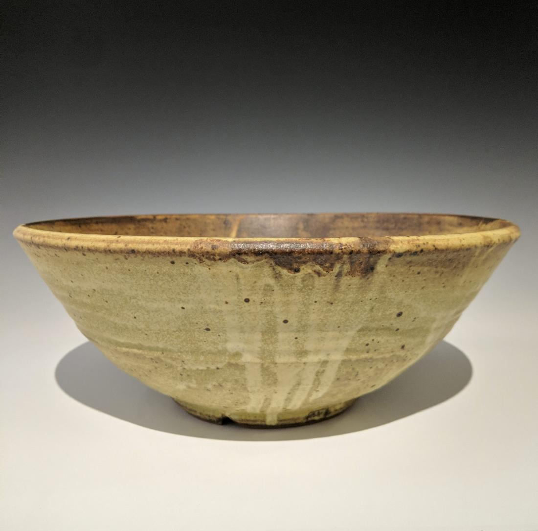 Warren MacKenzie - Large colander: Lot 131 Warren MacKenzie - Large colander American (1924-2018) Large colander stoneware with matte yellow glaze MacKenzie stamp on foot 5 x 13 inches Provenance: from the Collection of Arthur & Lill