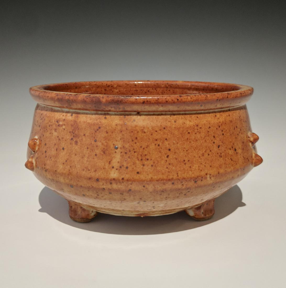 Warren MacKenzie - Shallow dish with three feet: Lot 142 Warren MacKenzie - Shallow dish with three feet American (1924-2018) Shallow dish with three feet stoneware with shino glaze MacKenzie stamp on foot 4 1/2 x 7 1/2 inches Provenance: from the C