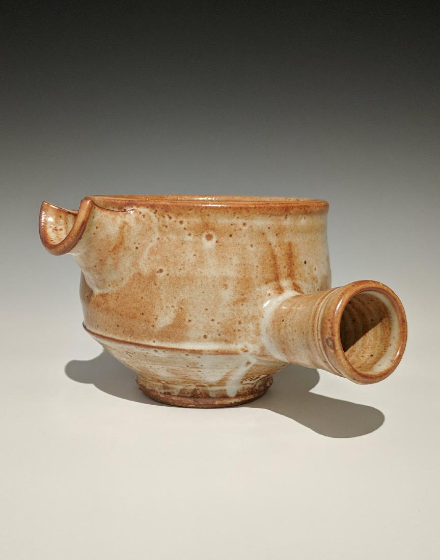 Warren MacKenzie - Spouted vessel with handle: Lot 145 Warren MacKenzie - Spouted vessel with handle American (1924-2018) Spouted vessel with handle stoneware with shino glaze MacKenzie stamp on foot 4 1/2 x 7 1/2 inches Provenance: from the Colle
