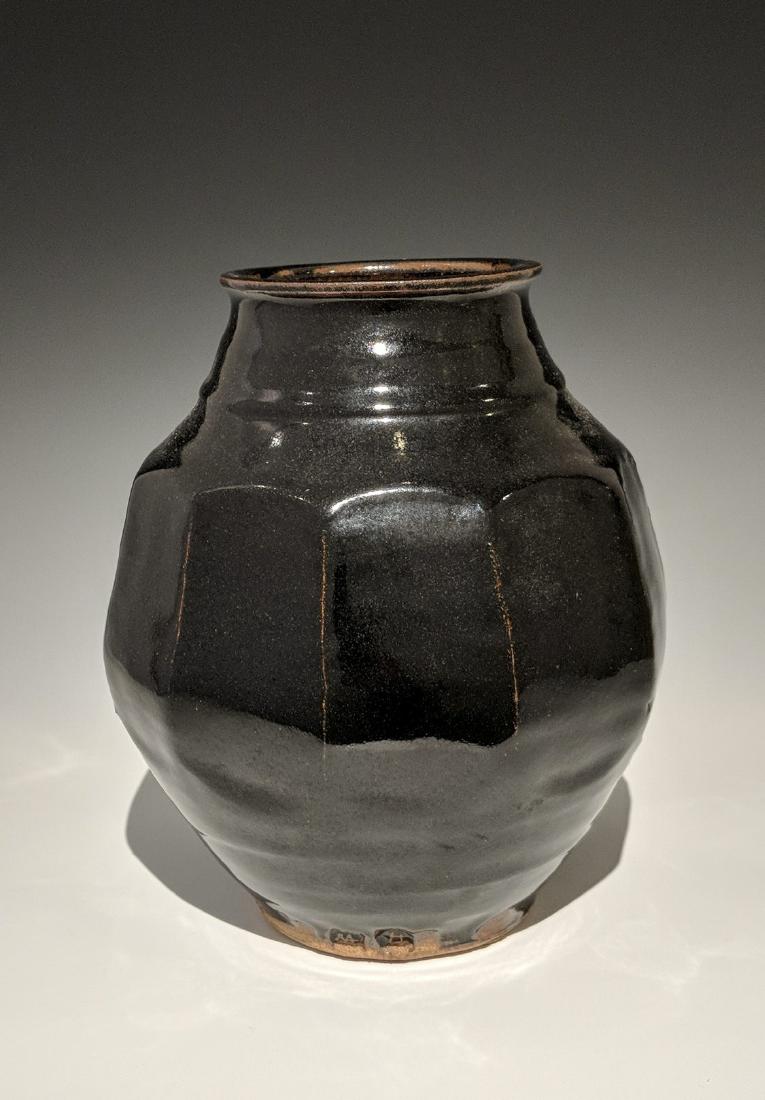 Warren MacKenzie - Large faceted vase: Lot 146 Warren MacKenzie - Large faceted vase American (1924-2018) Large faceted vase stoneware with tenmuko glaze MacKenzie and Stillwater stamp 11 x 4 1/2 inches Provenance: from the Collection of A