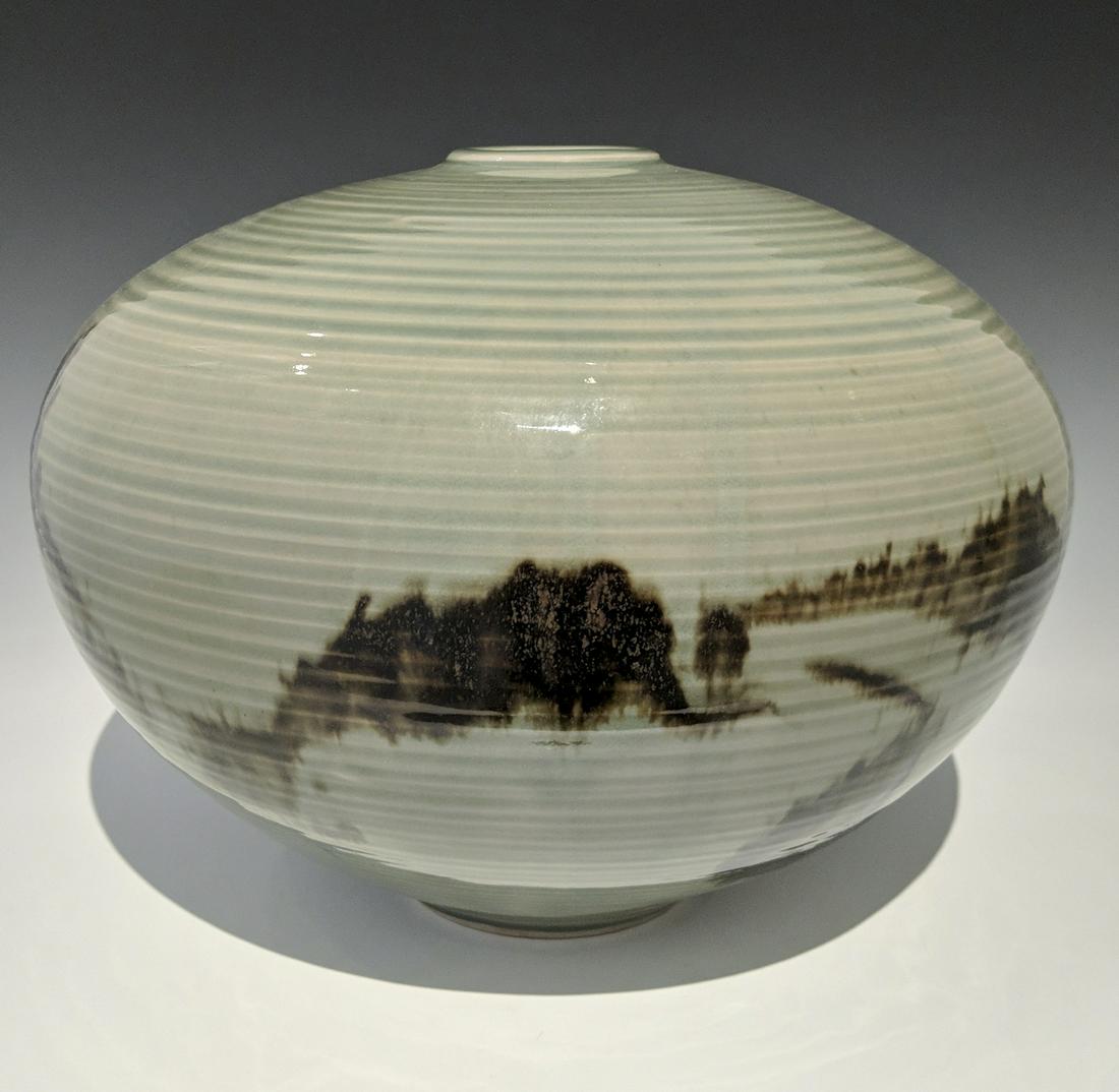 Otto and Vivika Heino - Vessel: Lot 218 Otto and Vivika Heino American (20th century) Vessel (1991) porcelain with celadon glaze with tenmoku brushwork signed on bottom 9 x 10 1/2 inches Provenance: from the Collection of Arth