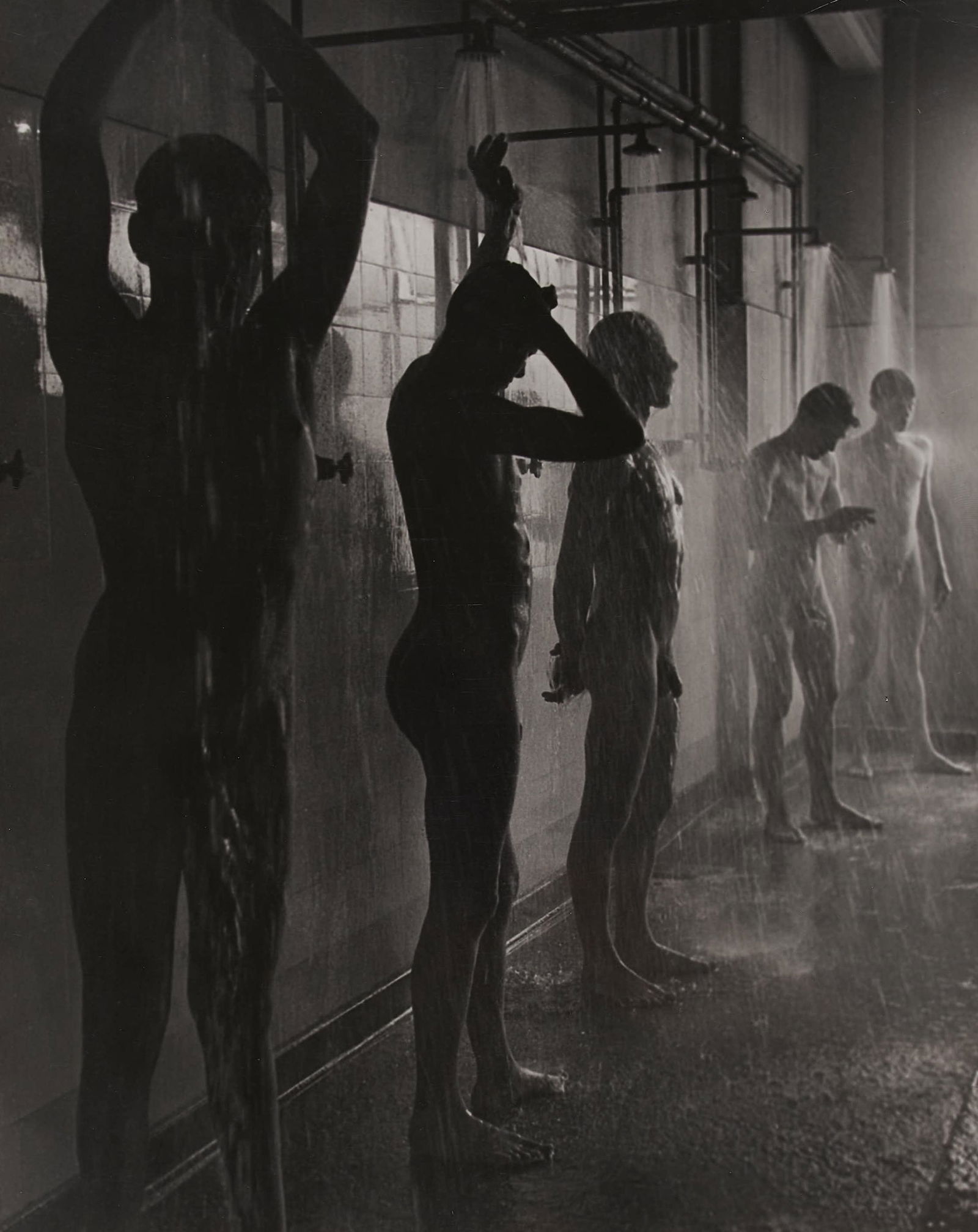 Herbert List - Workers in the Shower: Lot 47 Herbert List German (1903-1975) Workers in the Shower silver gelatin mounted to mat estate stamp verso 11 5/8 x 9 1/4 inches Provenance: From the Estate of Edward Bazinet