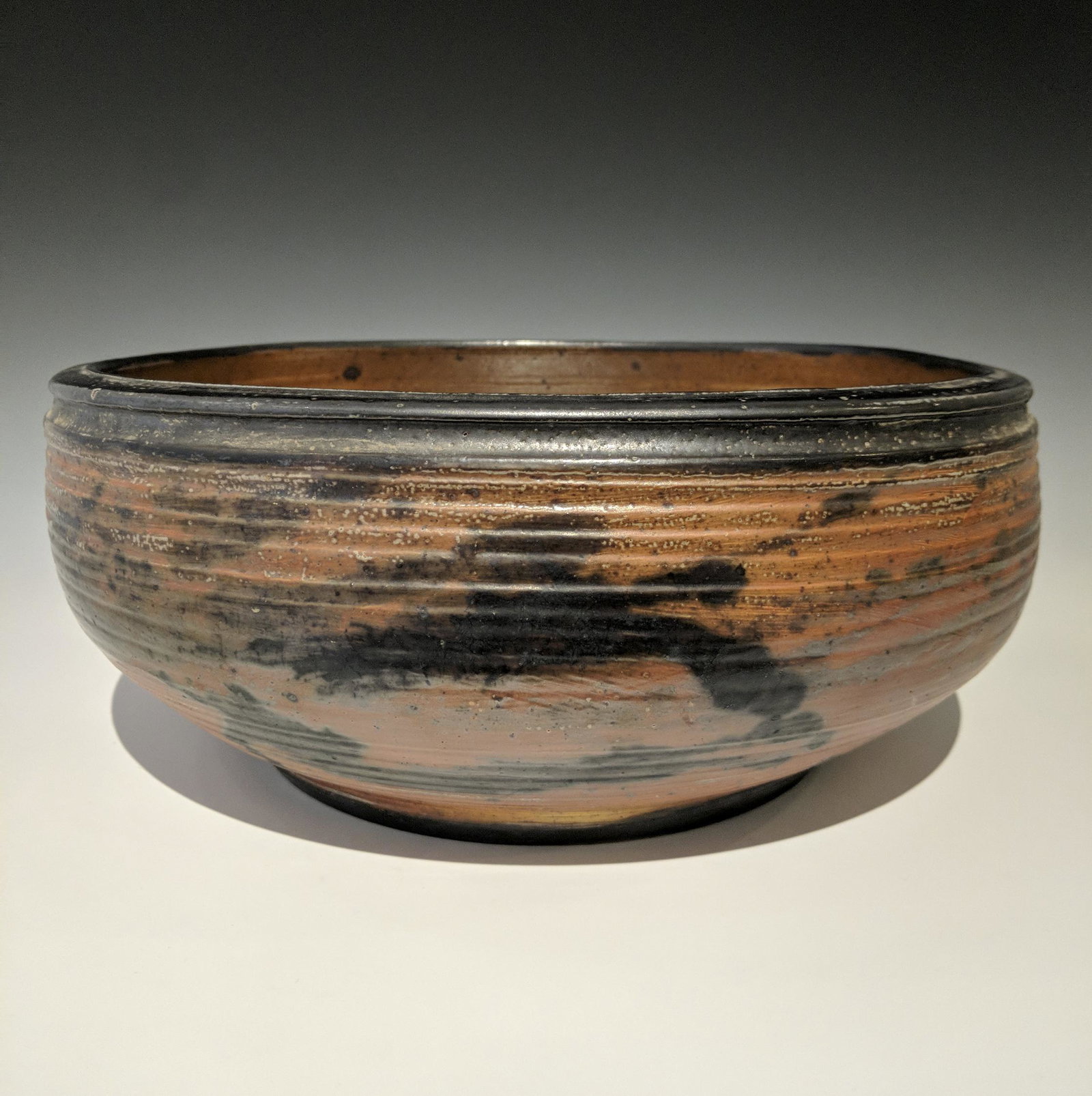 Otto and Vivika Heino - Shallow bowl: Lot 78 Otto and Vivika Heino American (20th century) Shallow bowl (1991) wood fired white clay body with salt glaze signed on bottom 6 x 13 inches Provenance: LDI from the Collection of Arthur &