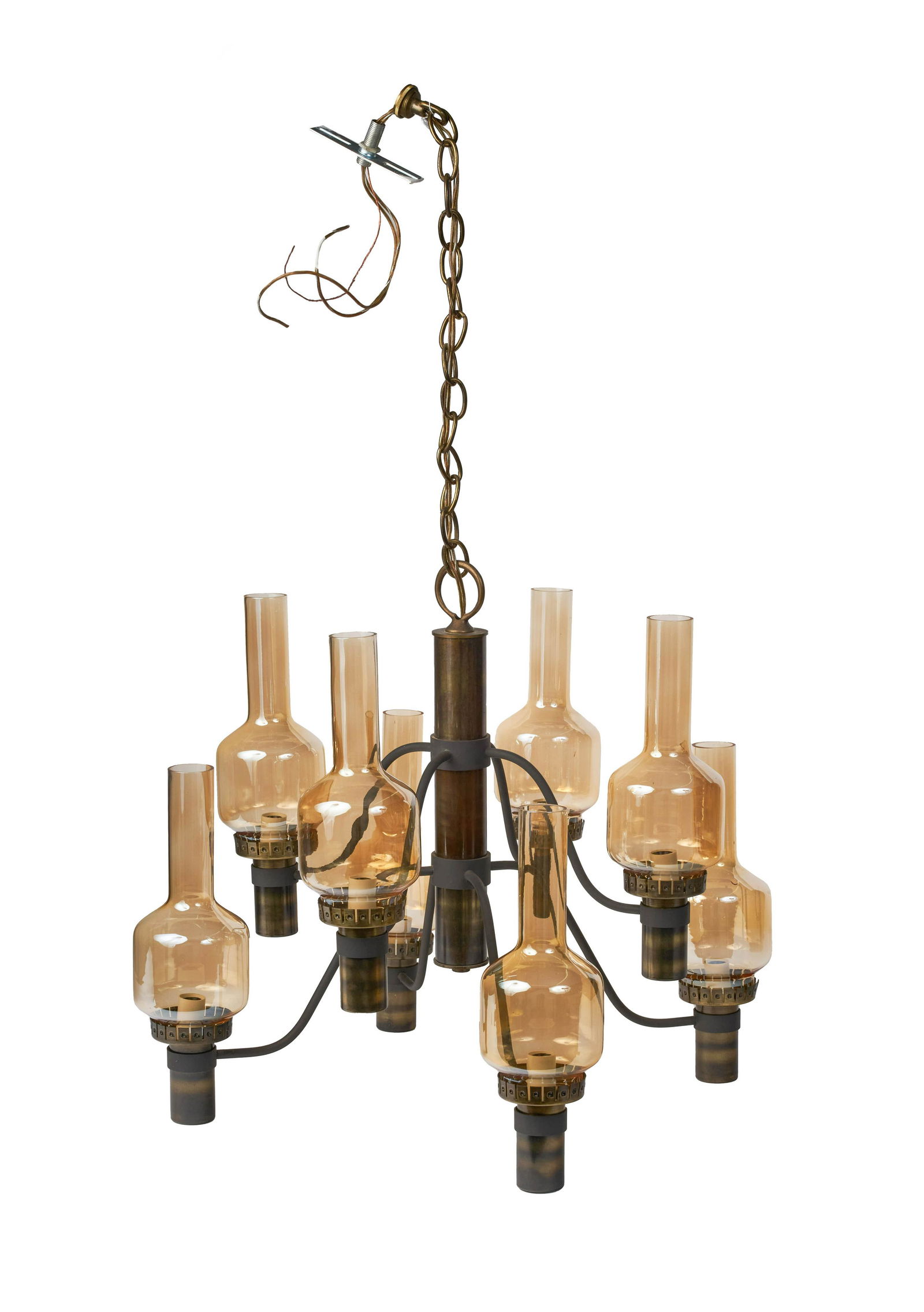 in the style of Hans-Agne Jakobsson - Chandelier: Lot 27 in the style of Hans-Agne Jakobsson Swedish (1919-2000) Chandelier brass with glass chimneys 18 1/2 x 18 x 18 inches Manufacture: Lightolier