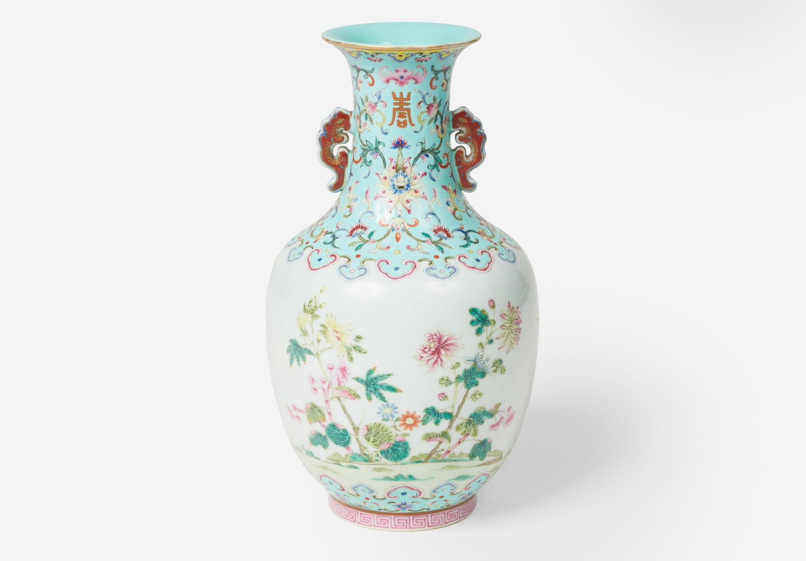 A Daoguang Porcelain Famille Rose Vase: Lot 141 A Daoguang Porcelain Famille Rose Vase (19th Century) A Daoguang vase of baluster form with tall neck and flared rim, the main body is decorated with blossoms between turquoise ground ruyi bor