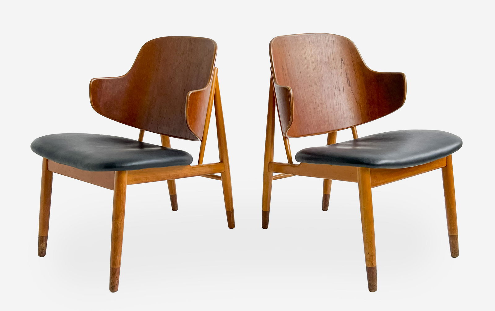 Ib Kofod-Larsen for Selig, Pair of Penguin Chairs: Lot 122 Ib Kofod-Larsen for Selig, Pair of Penguin Chairs having a beech wood frame with teak bentwood back and black cushion seat, each stamped to underside: 'Made in Denmark' one with Selig manufac