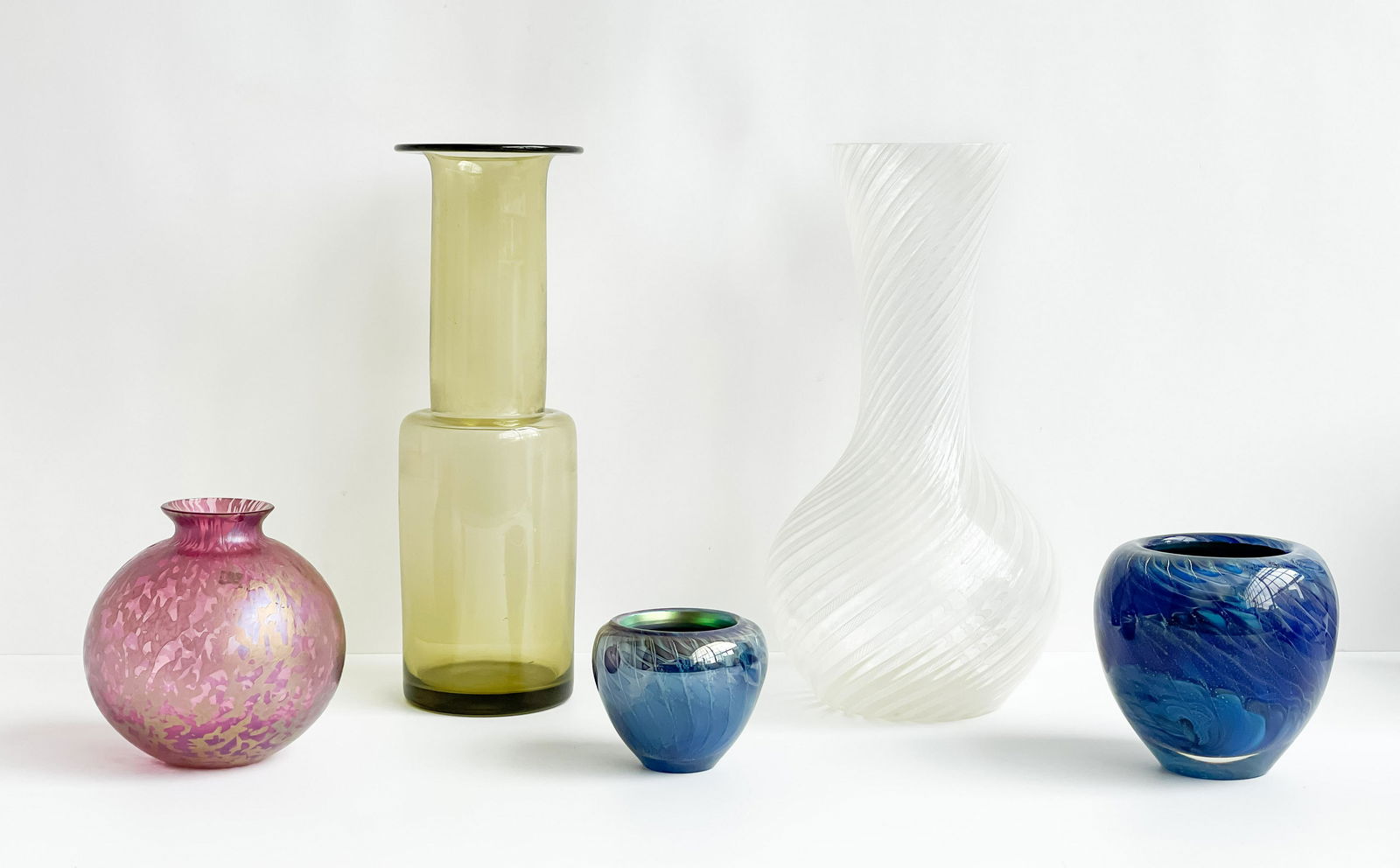 Murano and Other Glass Vases, Group of 5: Lot 202 Murano and Other Glass Vases, Group of 5 lot includes one Salviati Murano swirl glass vase and one green Holmegaard glass vase height (largest): 15 1/4 inches diameter (largest): 8 inches Pro