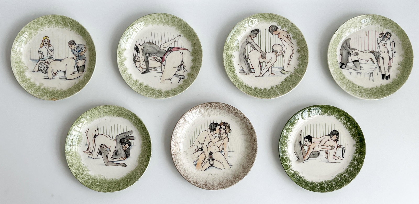 Seven Erotic Painted Dinner Plates: Lot 118 Seven Erotic Painted Dinner Plates The assembled group each with a mottled border around scenes of various figures engaged in an array of sex acts Diameter 9 1/2 inches Provenance: Property fr