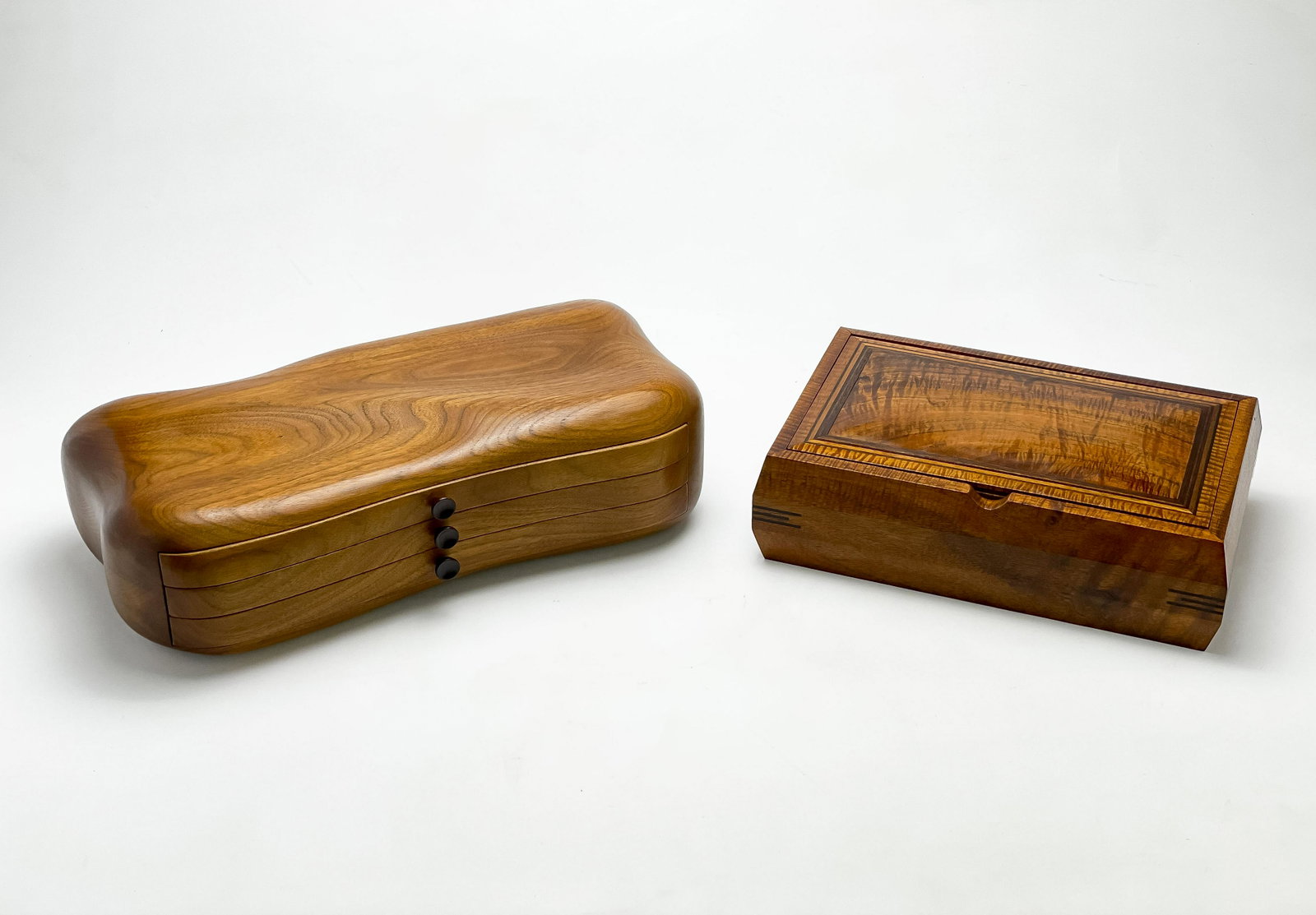 Artisanal Wood Jewelry Boxes, Group of 2: Lot 151 Artisanal Wood Jewelry Boxes, Group of 2 one rectangular handmade jewelry box with hinged top closure, underside incised with 'Kavanagh Chest / Designed and handmade by Tony Lydgate © 198