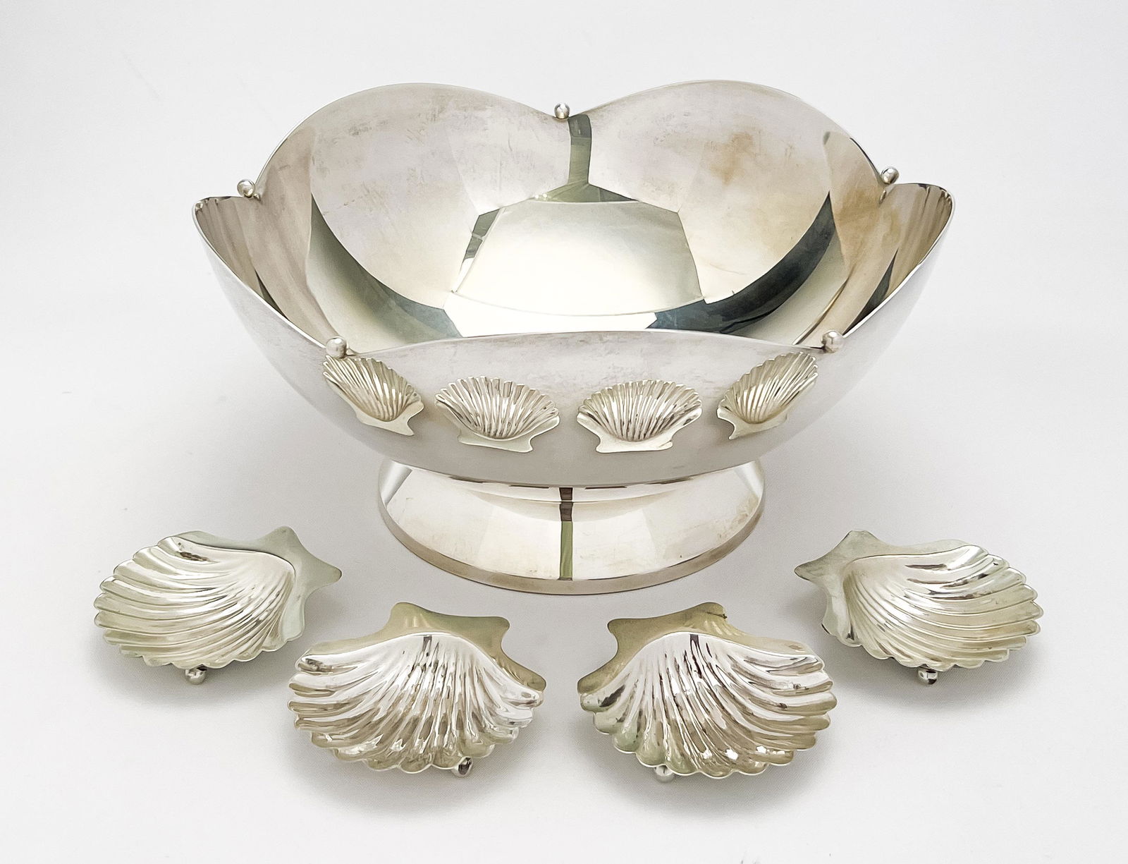 Cartier Sterling Bowl and Salt Cellars: Lot 195 Cartier Sterling Bowl and Salt Cellars each stamped 'Cartier' and 'Sterling' to underside 710 grams bowl: 4 1/2 x 9 x 9 inches Provenance: From a Private Collection