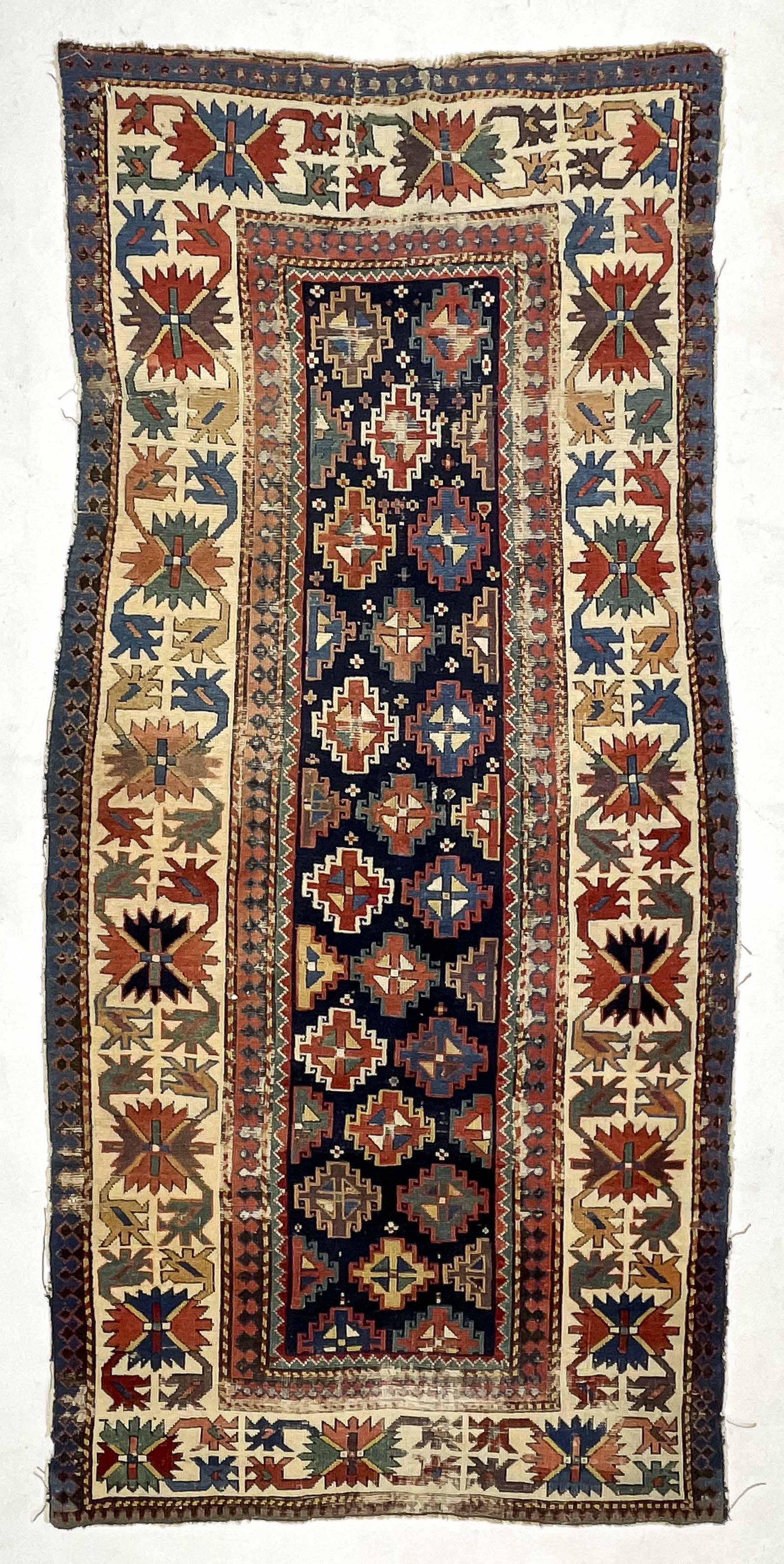 Kazak Rug: Lot 30 Kazak Rug Southwest Caucasus c. 1875 7 ft 11 in x 3 ft 9 1/2 in Provenance: Jim Dixon Collection