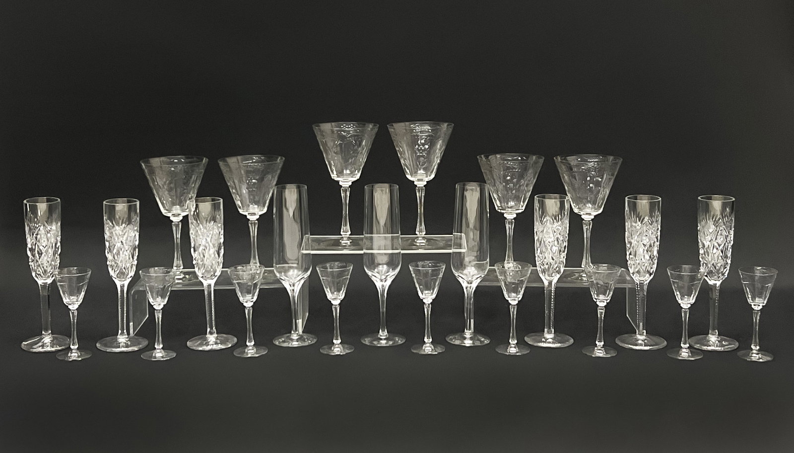 Saint Louis and Other Crystal Stemware: Lot 56 Saint Louis and Other Crystal Stemware lot includes: 6 Saint Louis champagne flutes in the ”Florence” pattern, acid-stamp to undersides; 6 crystal wine glasses and 9 cordial glasses