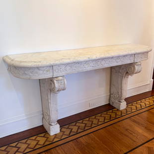 Marble Console Table: Lot 136  Marble Console Table marble top with carved apron atop two scrolled and carved marble legs 38 x 77 x 20 inches Additional Information: this lot is offered with no reserve Provenance: From a P