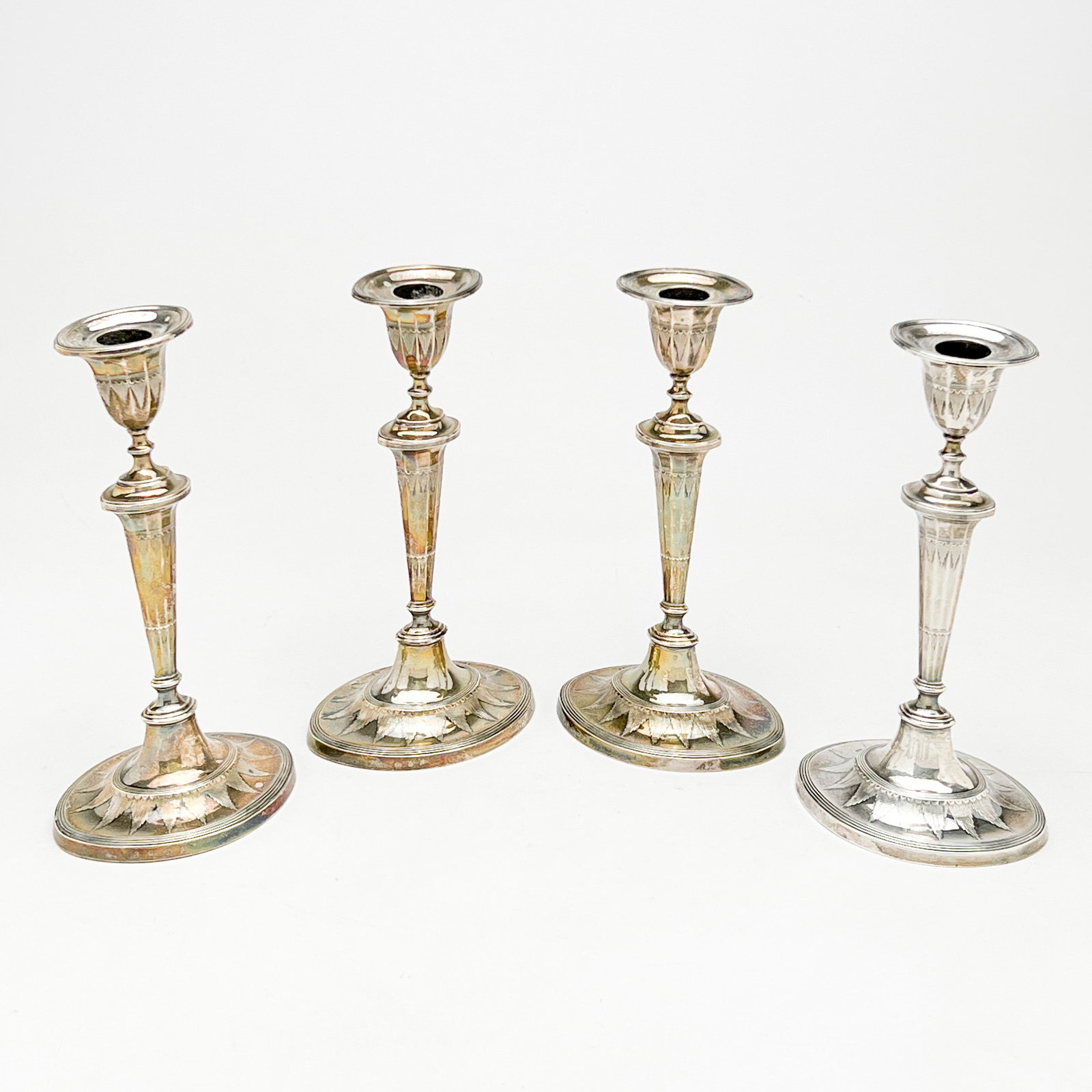 Sterling Weighted Candle Sticks, Group of 4: Lot 61 Sterling Weighted Candle Sticks, Group of 4 Each with Hallmarks height (each): 9 1/4 inches Provenance: From a 956 5th Ave Estate