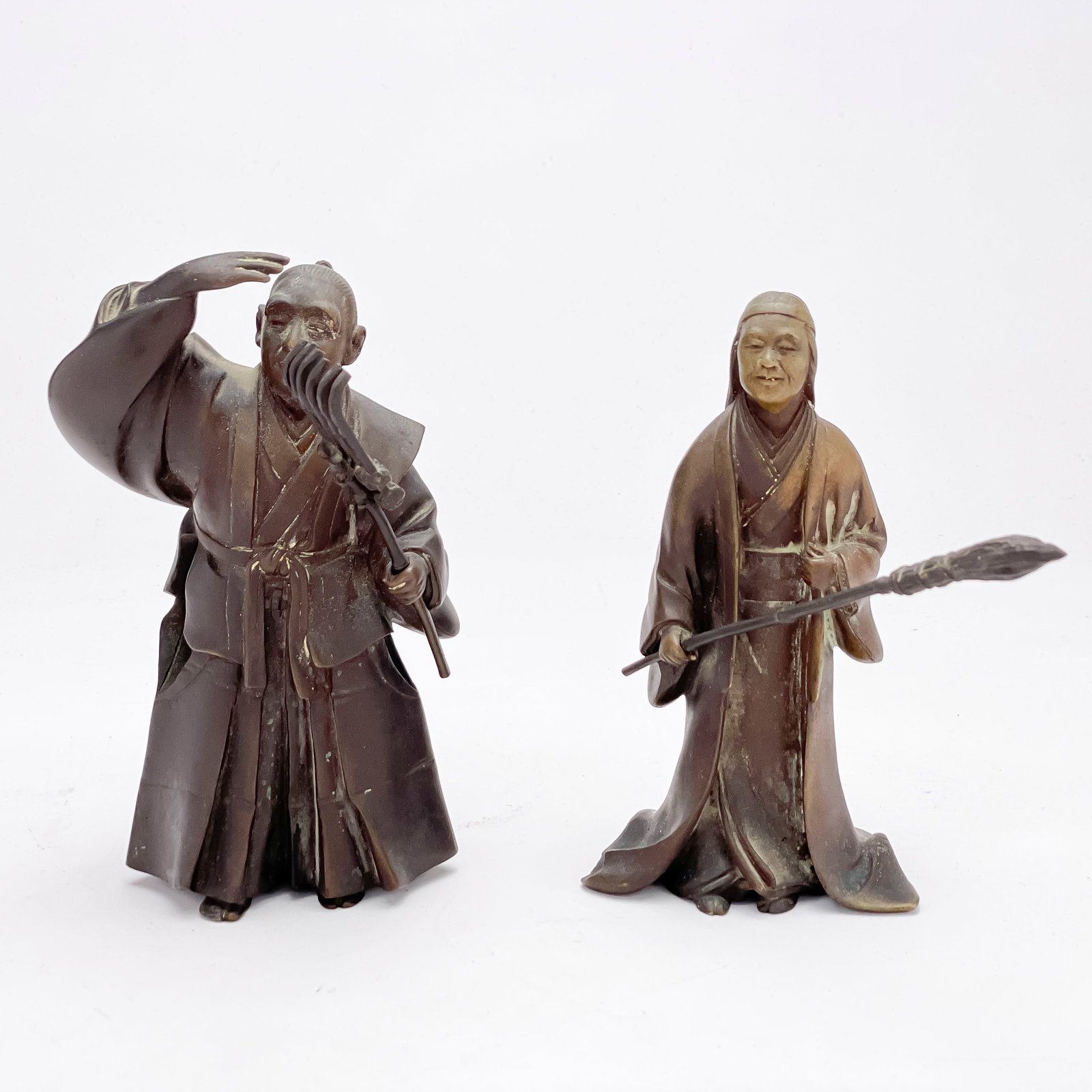 Japanese Takasago Bronze Figures of Jo and Uba: Lot 158 Japanese Takasago Bronze Figures of Jo and Uba the couple acting as a symbol of the happiness of family life, with the female figure of Uba carrying a broom and the male figure of Jo carrying 