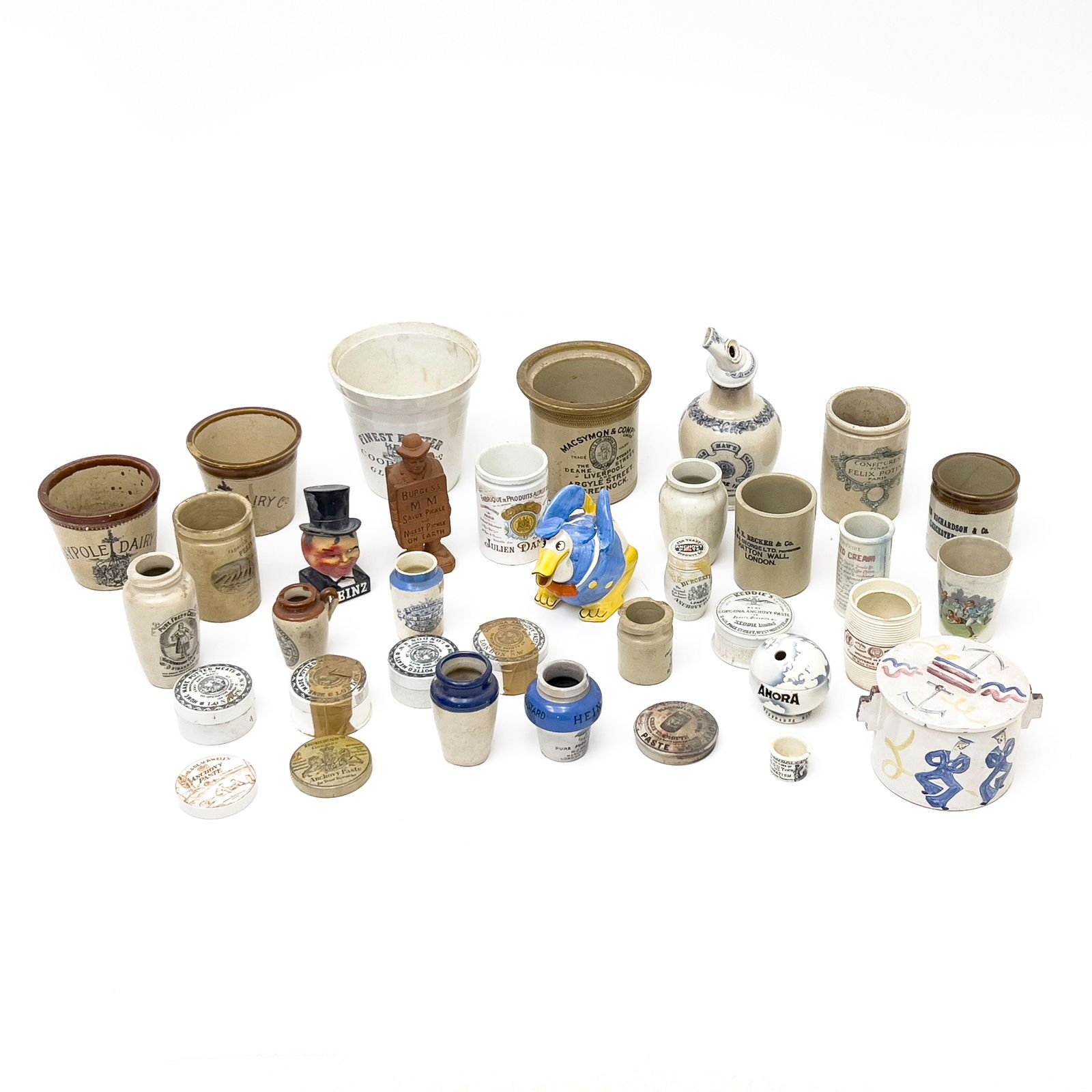 Food Advertising Lot, Group of 35: Lot 26 Food Advertising Lot, Group of 35 comprising steins, pots, vases, teapot, and decorative boxes, and other articles relating to food advertising largest: 7 1/2 x 8 x 8 inches Provenance: Proper