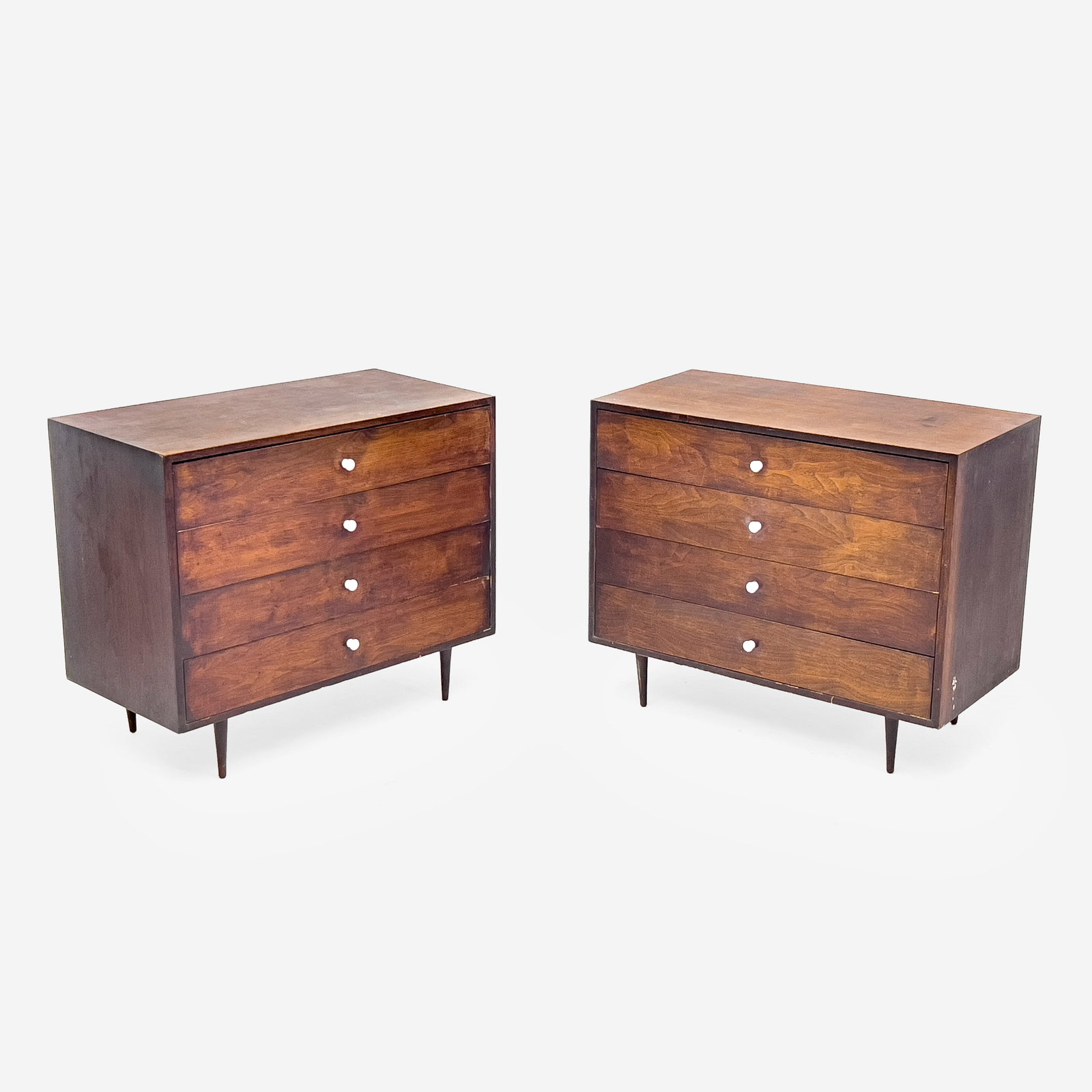 Mid Century Modern Dressers, Pair: Lot 142 Mid Century Modern Dressers, Pair in the style of George Nelson, each with four drawers, rising on tapered legs each 30 x 36 x 18 inches Provenance: Property from the Estate of Rosa and Aaron 