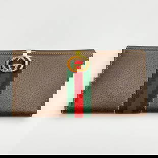 Gucci - Leather Wallet: Lot 10 Gucci Italian Manufacturer (Founded 1921) Leather Wallet single fold leather wallet with Gucci logo clasp marked Gucci to interior 3 1/2 x 7 inches Provenance: From a Private New York Collectio