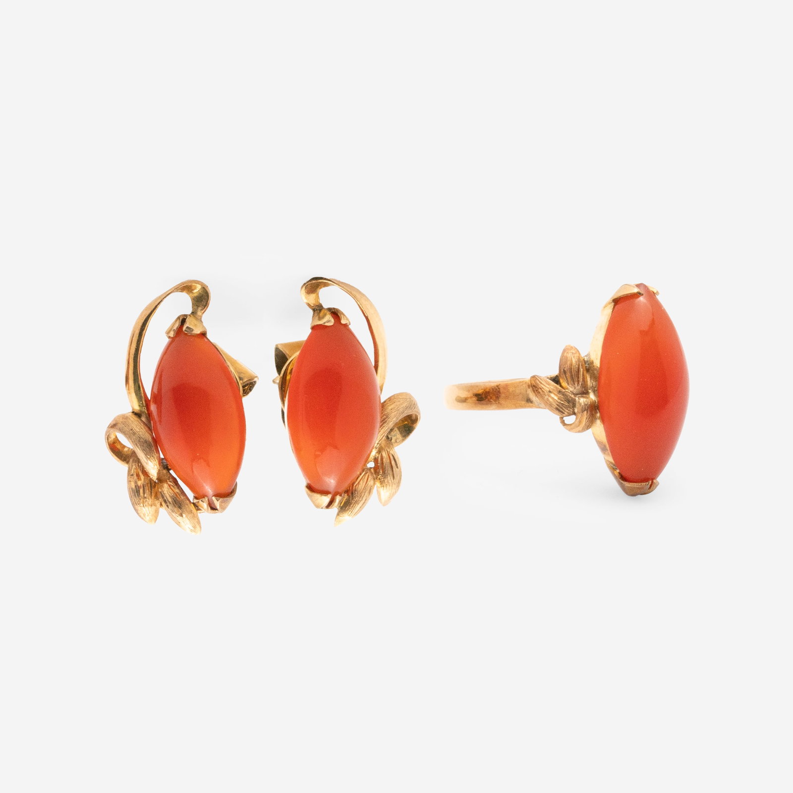 Yellow Gold and Carnelian Ring and Earrings: Lot 35 Yellow Gold and Carnelian Ring and Earrings 18K yellow gold carnelian cocktail ring, size 4 1/2, and stud earrings featuring clutch back closures each stamped Additional Information: Th