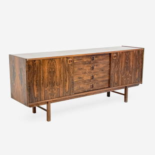 Ladoga Mid Century Rosewood Veneer Sideboard for IKEA: Lot 182 Ladoga Mid Century Rosewood Veneer Sideboard for IKEA (1960s) featuring four central drawers, slide doors on both sides, opening to a storage compartment with a single shelf, raised on