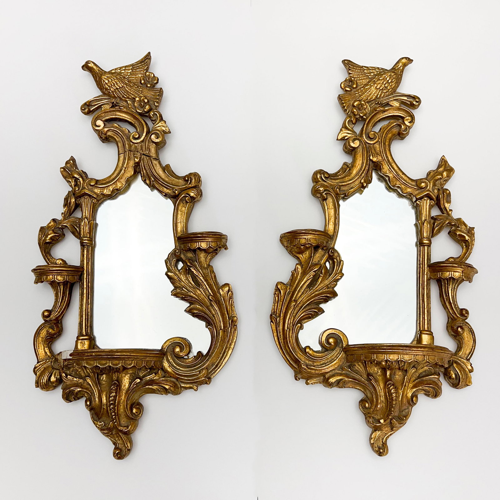 Rococo Gild Mirror, Pair: Lot 171 Rococo Gild Mirror, Pair floral and foliate motifs with architectural elements, each crowned with a bird, with conforming mirror and integral demilune shelf each: 30 x 15 inches Provenance: A 
