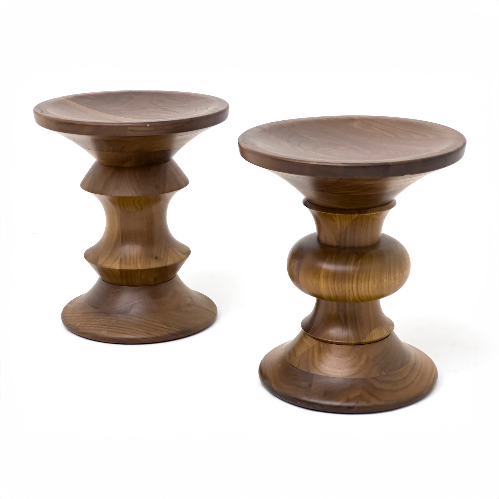 Charles and Ray Eames - Time Life Building Turned Wood Stools, Near Pair: Lot 42 Charles and Ray Eames American (20th Century) Time Life Building Turned Wood Stools, Near Pair walnut designed for the Time-Life Building in New York City height: 15 inches diameter: 6½ in