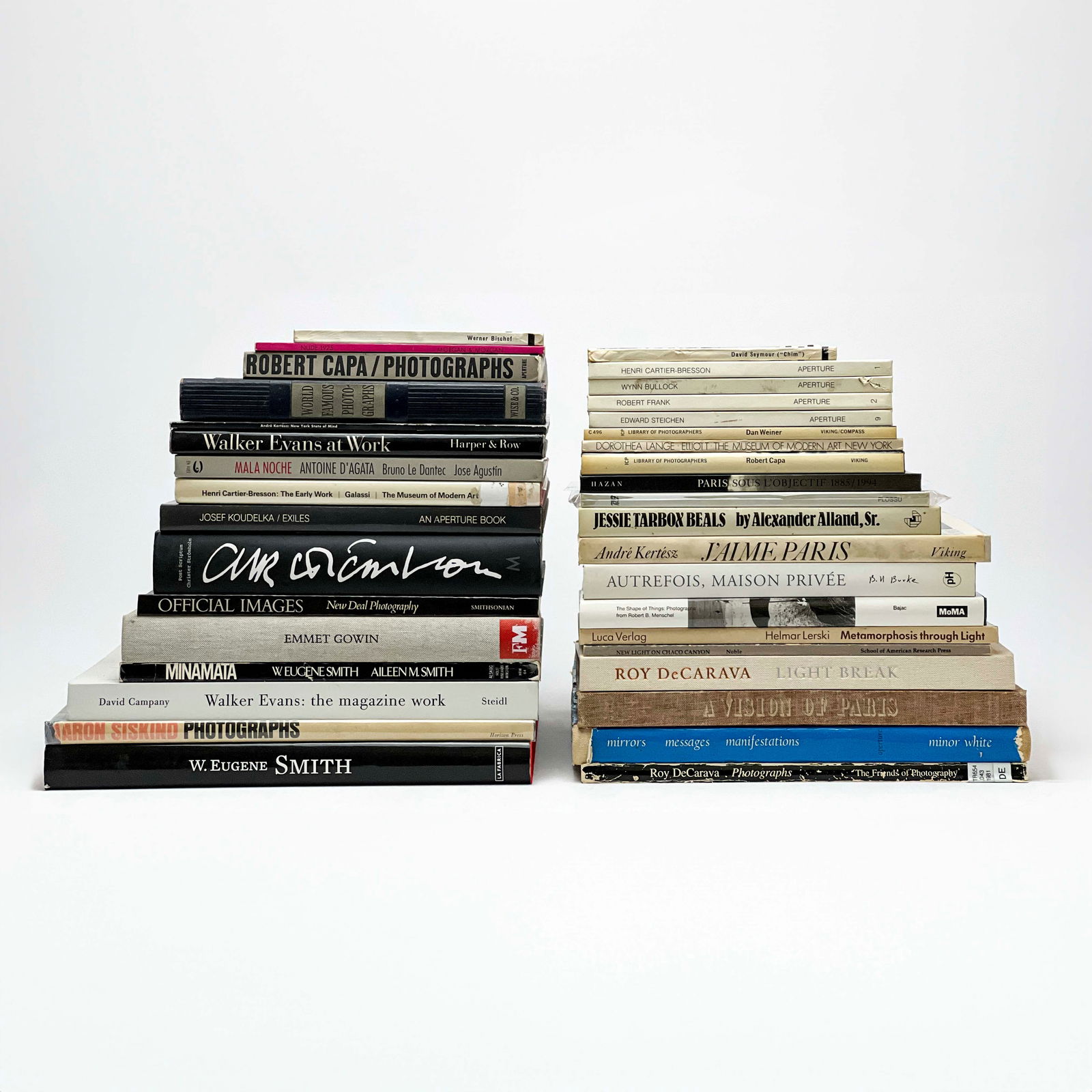 Collection of Early Photography Books, Group of 34: Lot 151 Collection of Early Photography Books, Group of 34 comprising volumes on W. Eugene Smith, Dorothea Lange, Henri Cartier-Bresson, Walker Evans, and more for video flip-through contact Capsule