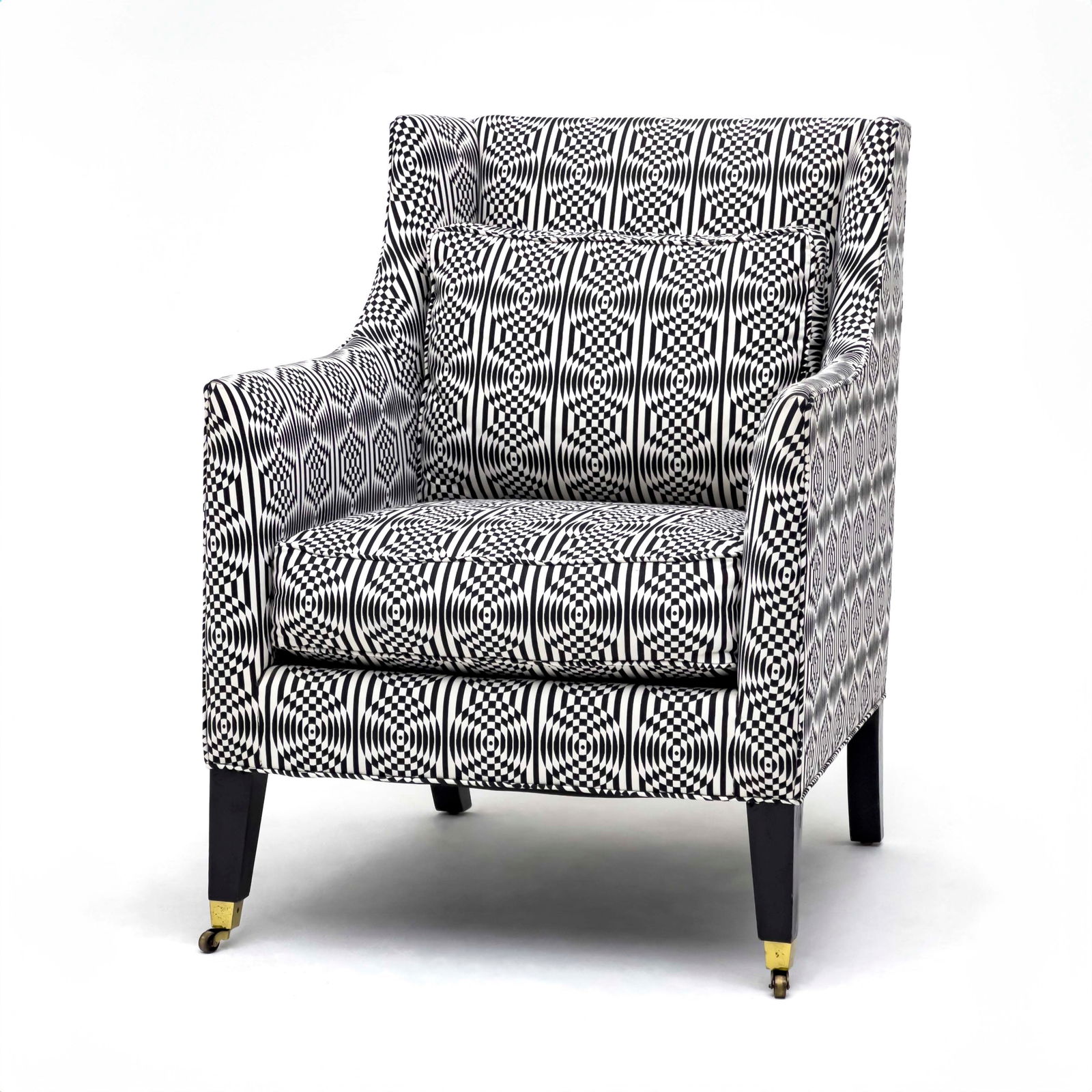 Black and White Armchair: Lot 53 Black and White Armchair upholstered in black and white geometric fabric, front legs raised on casters 39 1/2 x 32 x 28 inches seat height: 20 inches Provenance: From the Estate of Linda R. H