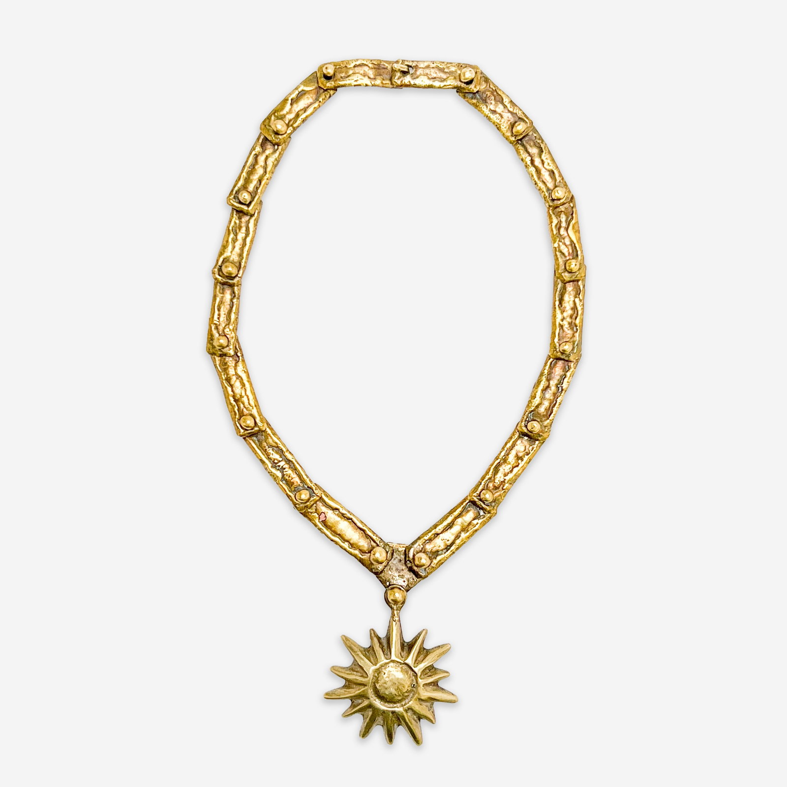 Pál Kepenyes - Necklace with Sun Pendant: Lot 110 Pál Kepenyes Hungarian (1926-2021) Necklace with Sun Pendant bronze signed to chain length: 17 1/2 inches pendant: 2 x 2 x 1/2 inches Additional Information: re-offer due to nonpaying bid