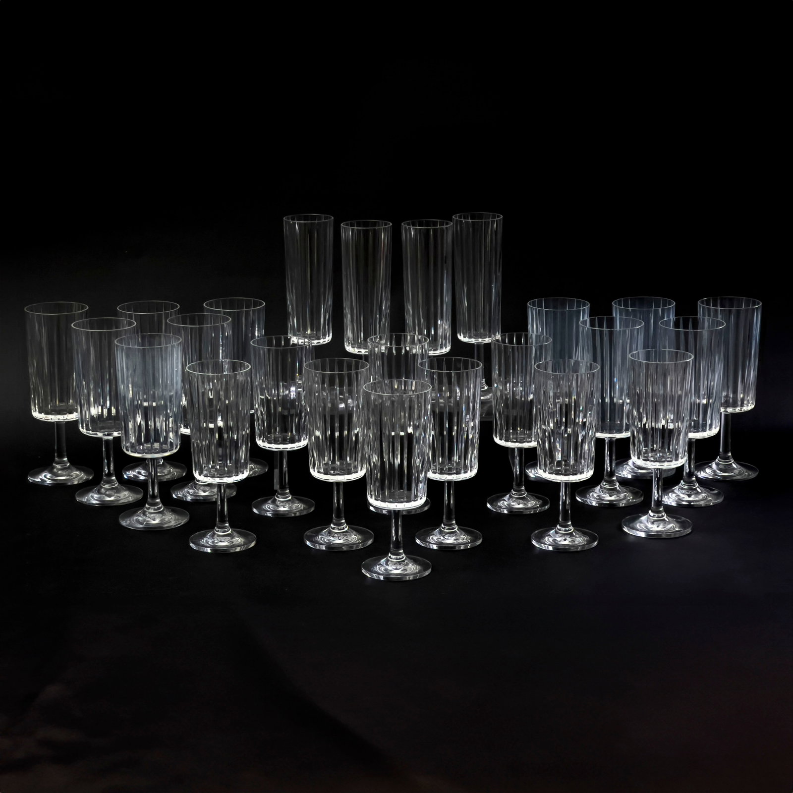 Baccarat - Harmonie Stemware, Group of 24: Lot 93 Baccarat French Manufacturer (est. 1764) Harmonie Stemware, Group of 24 various sizes comprising of 4 champagne flutes, 9 white wine, 11 red wine each stamped to verso largest: 8 x 2 1/2 inches