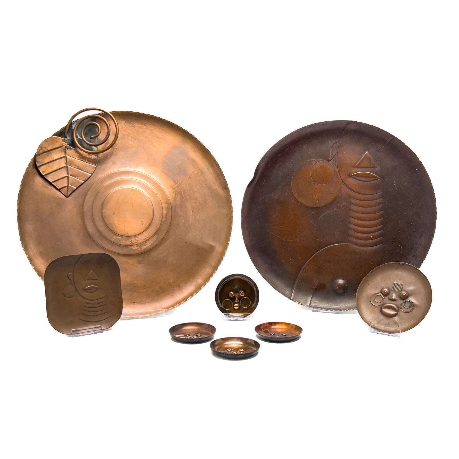 Francisco Rebajes - Copper Platter Collection, Group of 8: Lot 47 Francisco Rebajes American/Dominican (1907-1990) Copper Platter Collection, Group of 8 copper 4 small platters, 2 medium platters, 2 large platters marked to top edge largest: 17 1/2 x 18 1/2 x