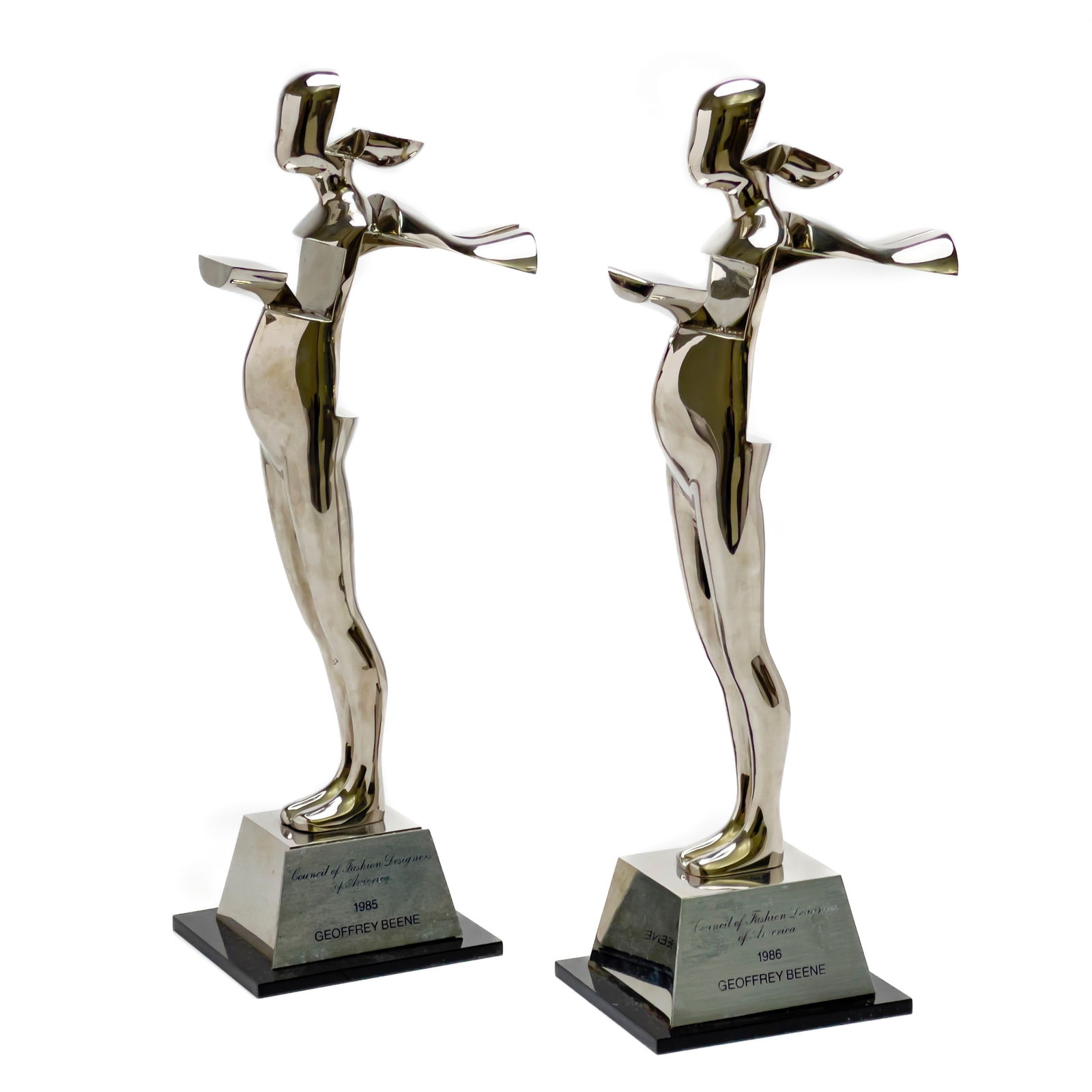 Ernest Trova - The Council of Fashion Designers of America Lifetime Achievement Award for Geoffrey: Lot 48 Ernest Trova American (1927-2009) The Council of Fashion Designers of America Lifetime Achievement Award for Geoffrey Beene, Pair stainless steel signature to back of base each: 13 3/4 x 5 1/2