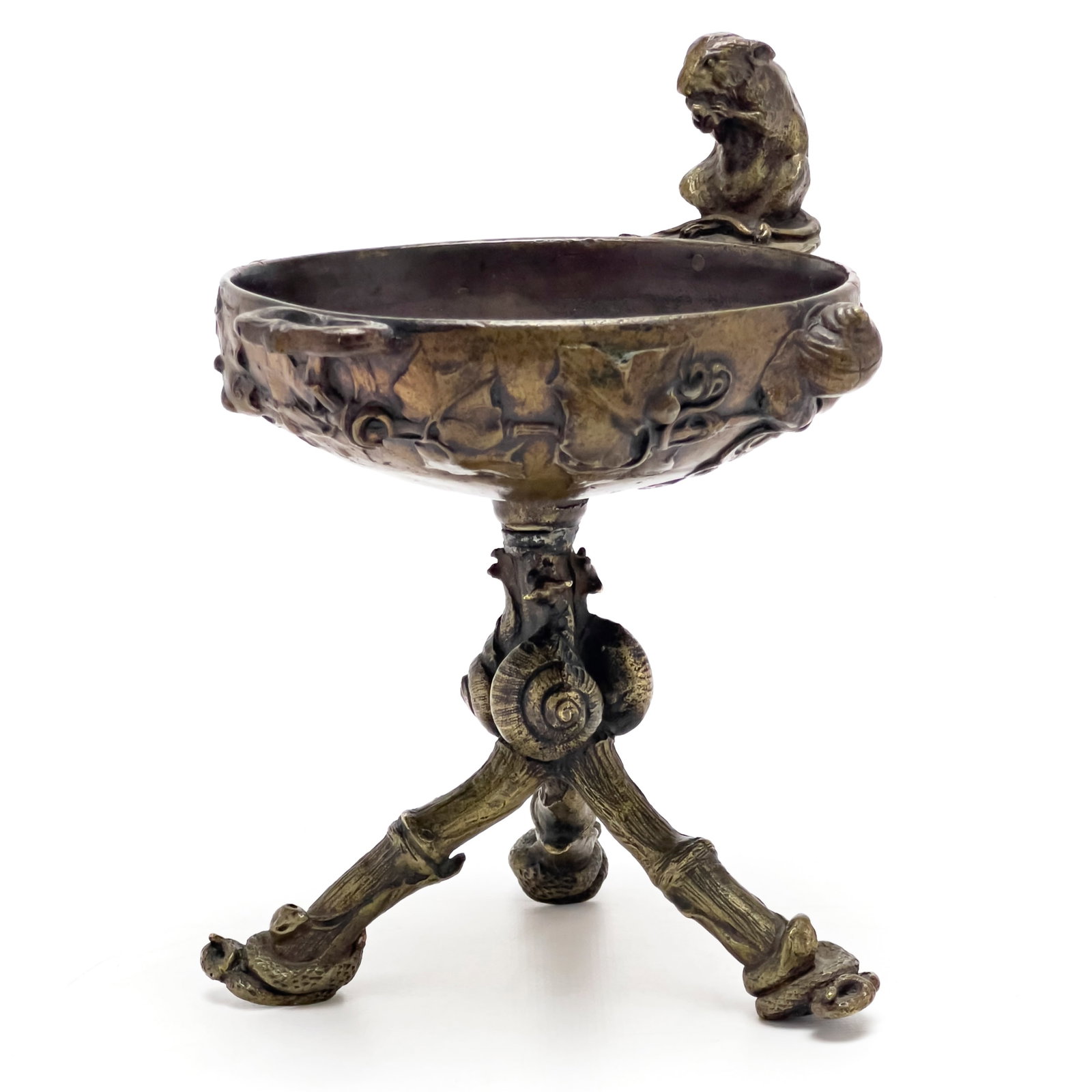 after Auguste Nicolas Caïn - Bronze Tazza with Snakes, Snails, and a Rat: Lot 58 after Auguste Nicolas Caïn Bronze Tazza with Snakes, Snails, and a Rat bronze bronze tripod tazza with details of snakes, snails, and a rat at the rim 6 1/8 x 5 3/4 inches Provenance: From