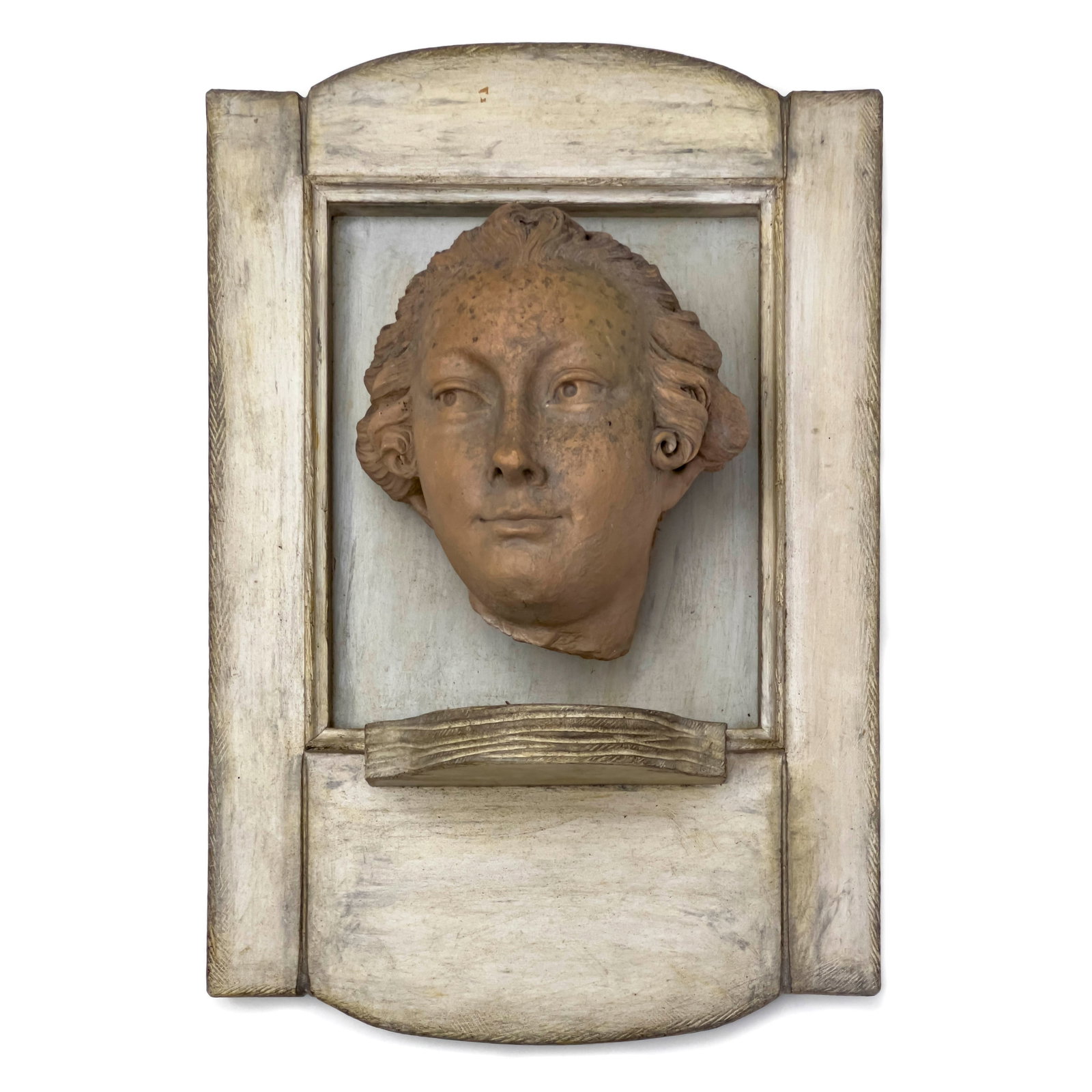 Classical Mounted Terracotta Relief Portrait: Lot 62 Classical Mounted Terracotta Relief Portrait terracotta, mounted to wood Terracotta head mounted to wood frame 20 1/2 x 14 x 7 inches Provenance: From the Collection of Roberta Gootrad
