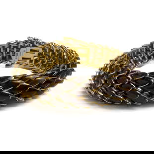 David Webb - Gold and Enamel Snake Bracelet: Lot 299 David Webb American Manufacturer (Founded 1925) Gold and Enamel Snake Bracelet 18K gold, enamel snake bracelet with brown enamel total approximate inclusive weight: 117 grams stamped to clasp