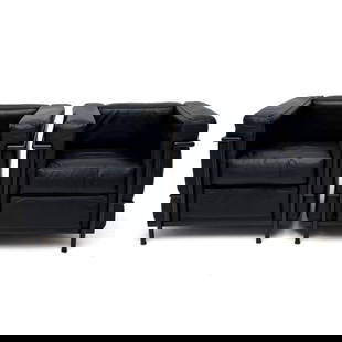 Le Corbusier LC2 style Armchairs, Pair: Lot 94  Le Corbusier LC2 style Armchairs, Pair leather, steel Comprising two black leather armchairs with black steel tubing each: 26 x 27 1/2 x 30 inches seat height: 17 1/2 inches Provenance: From a